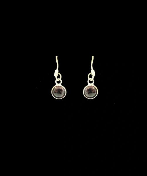 A pair of Super Silver Garnet Red Round Dangle Earrings with a black stone.