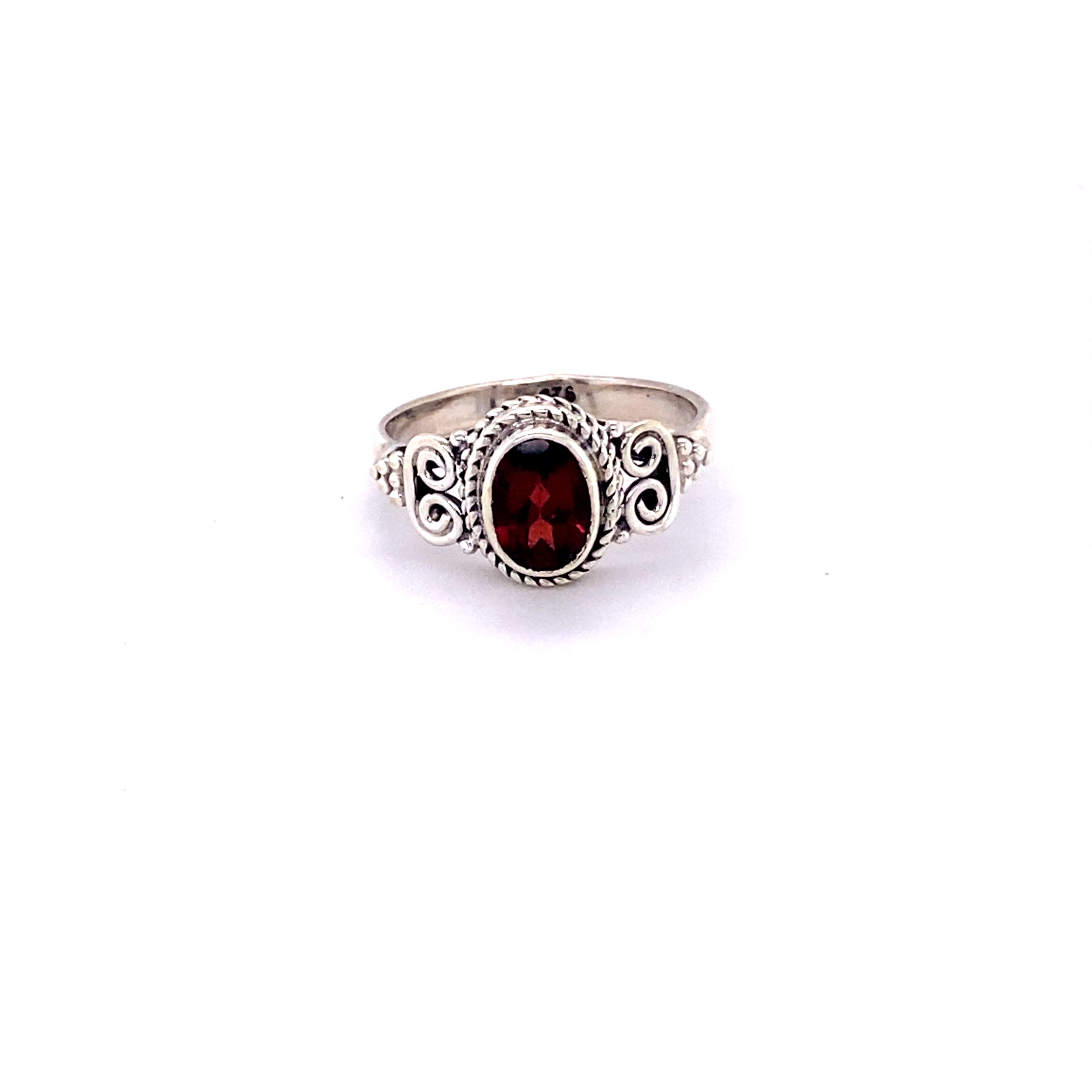 A sterling silver oval faceted gemstone ring with a swirl design.