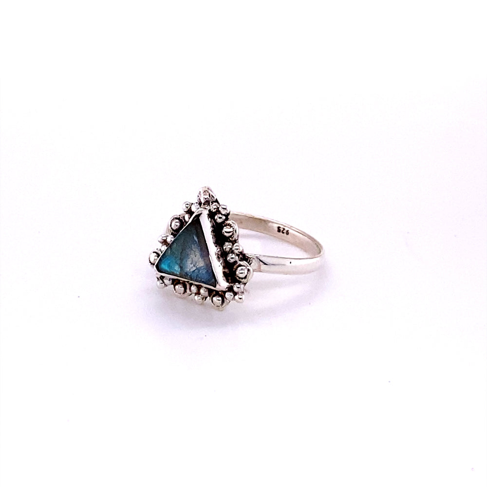 
                  
                    A Delicate Gemstone Triangle Ring with a Super Silver band and a triangle shaped stone.
                  
                