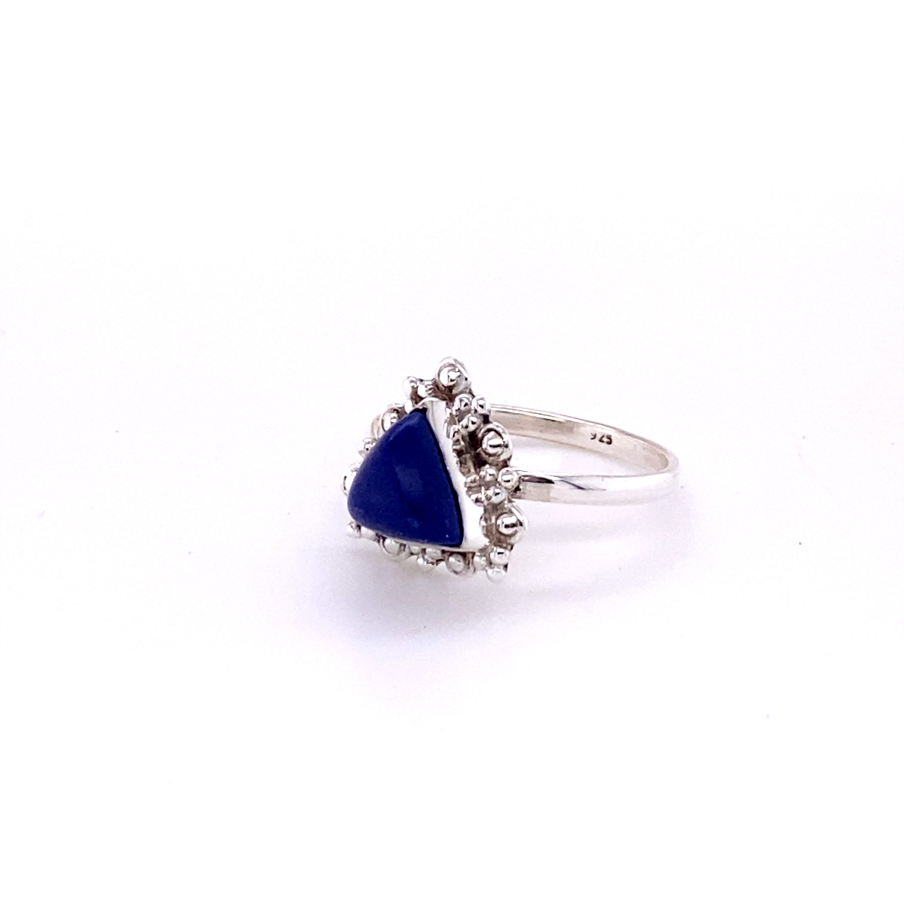 A Delicate Gemstone Triangle Ring adorned with a lapis stone and surrounded by shimmering diamonds, set in Super Silver.