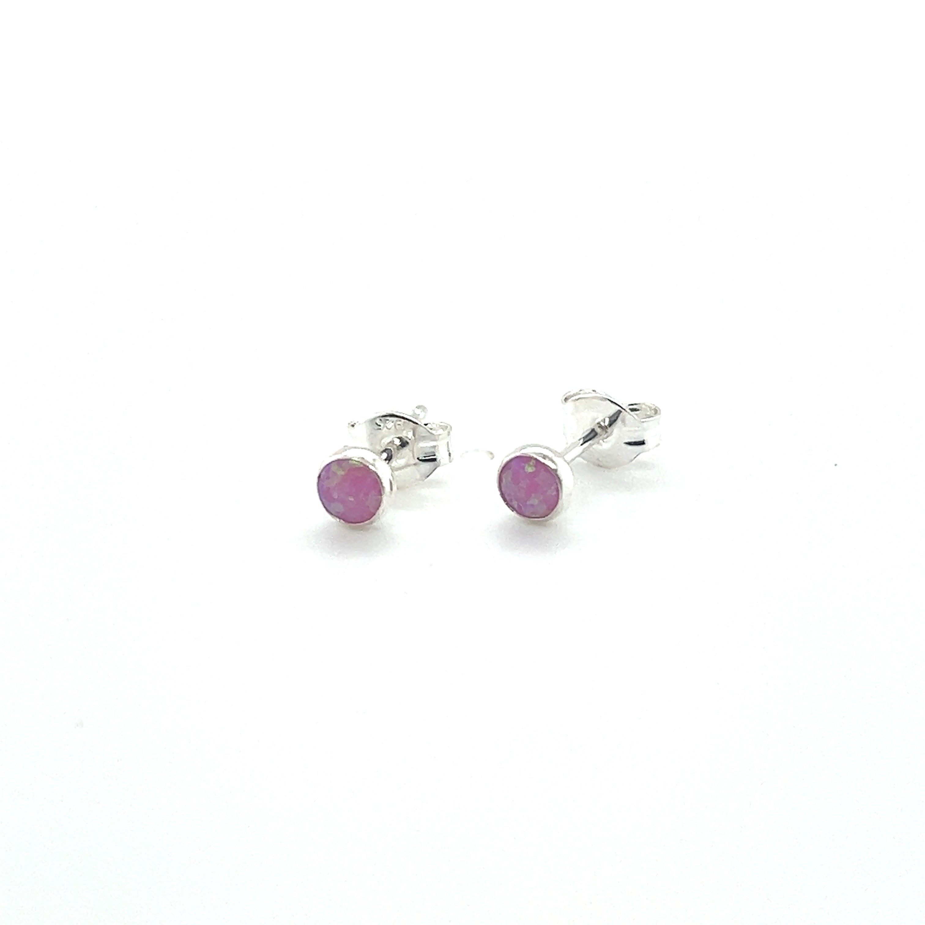 A pair of Dainty Opal Studs by Super Silver on a white background.