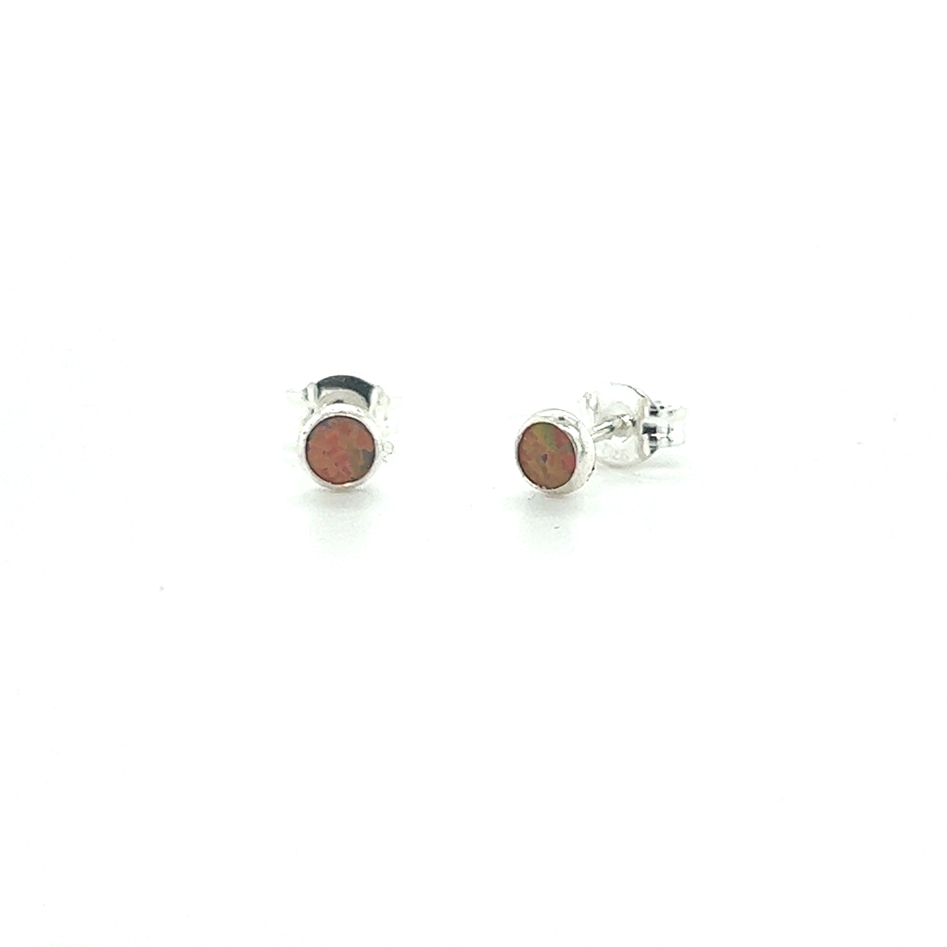 A pair of Super Silver's Dainty Opal Studs with red opal stones.