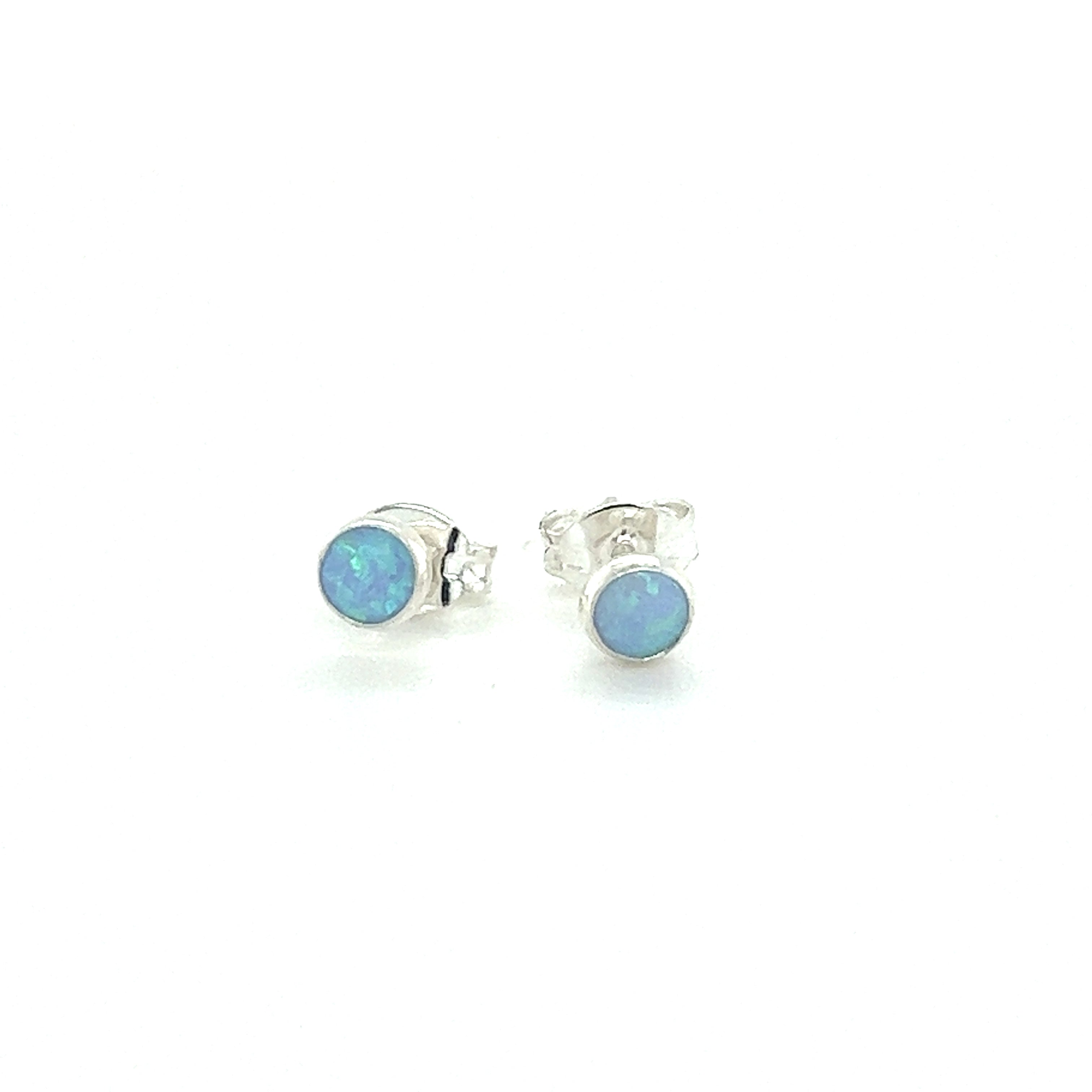 A pair of Super Silver Dainty Opal Studs featuring minimalist designs on a white background.