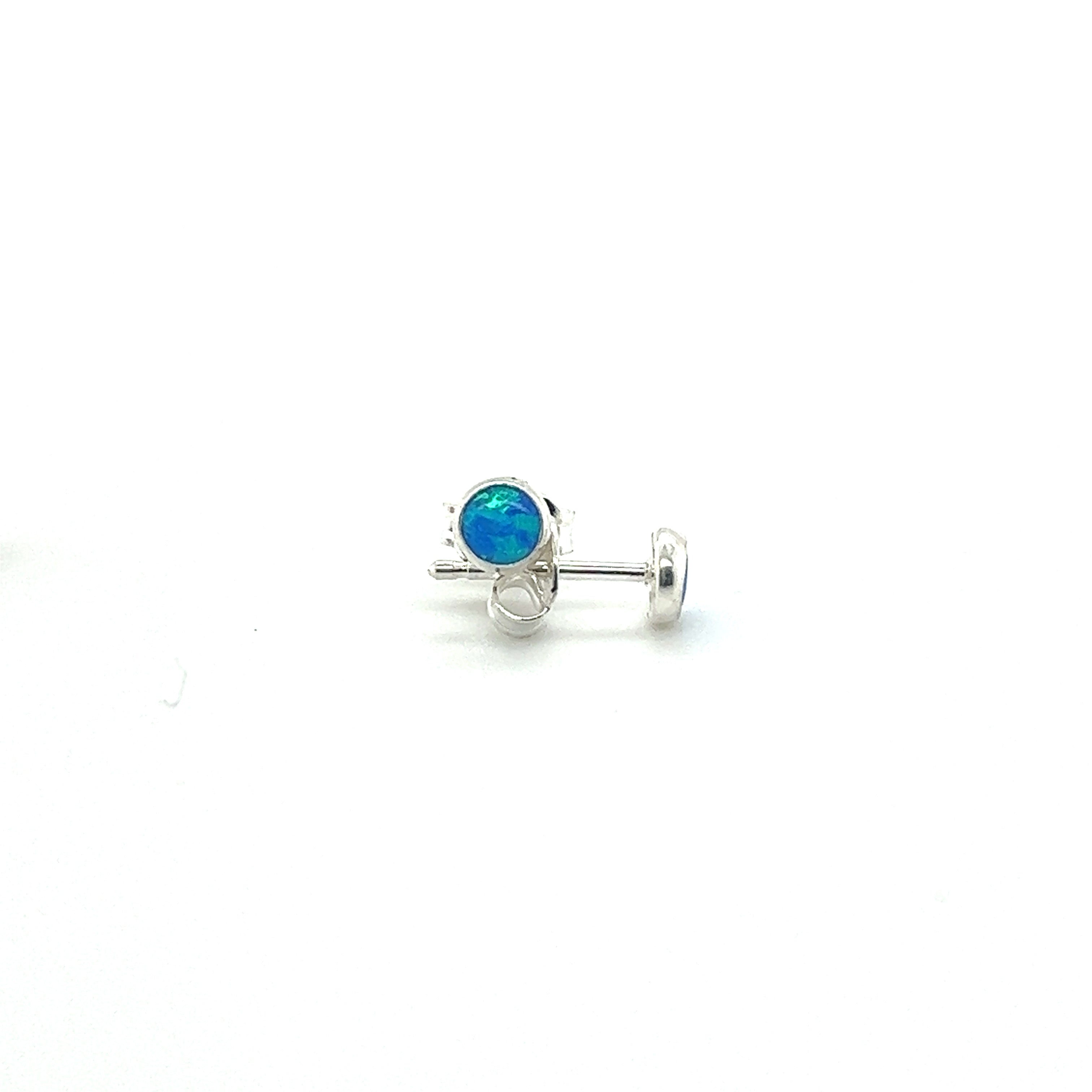 A pair of Super Silver Dainty Opal Studs on a white background, crafted with sterling silver.