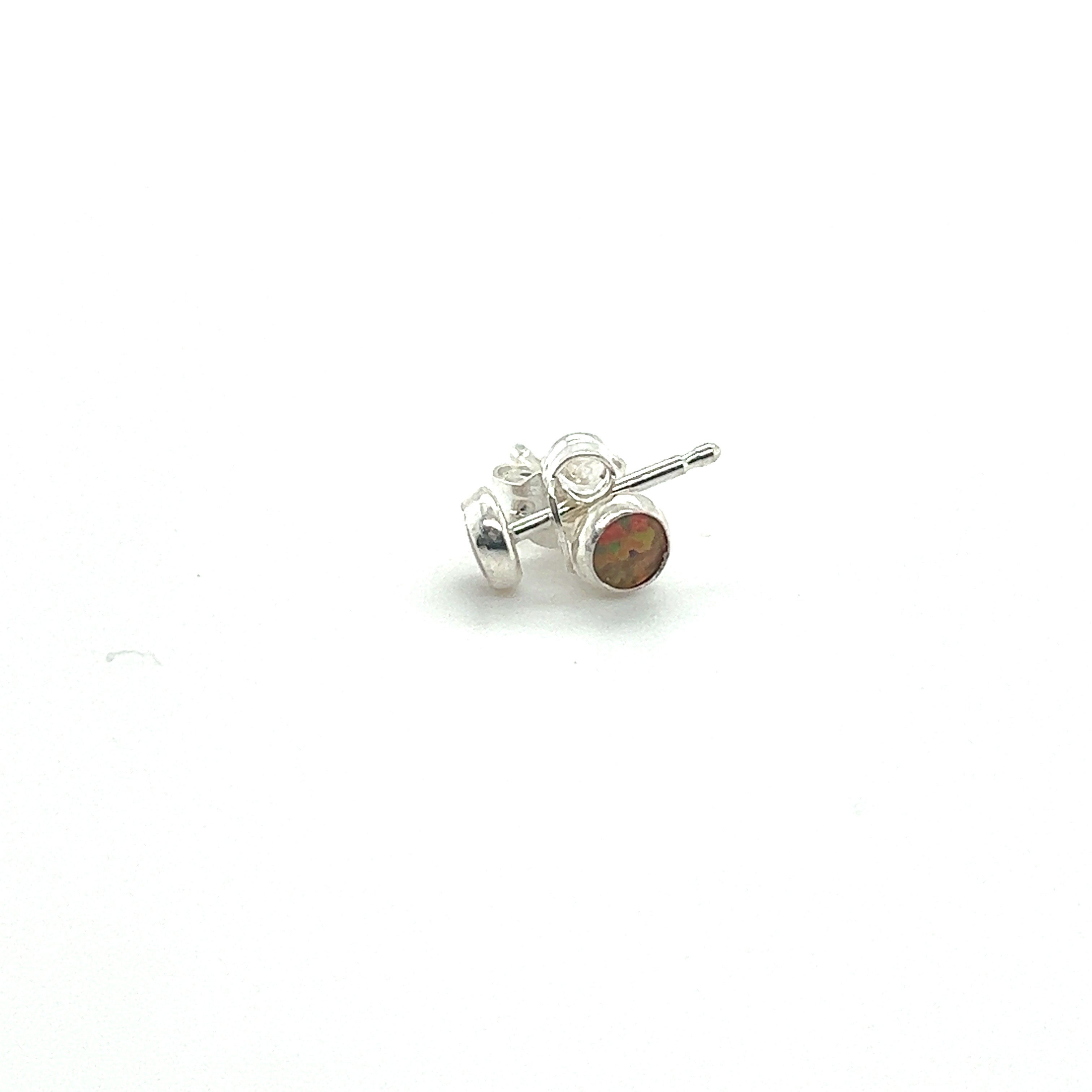 A pair of minimalist Dainty Opal studs crafted from sterling silver on a white surface by Super Silver.