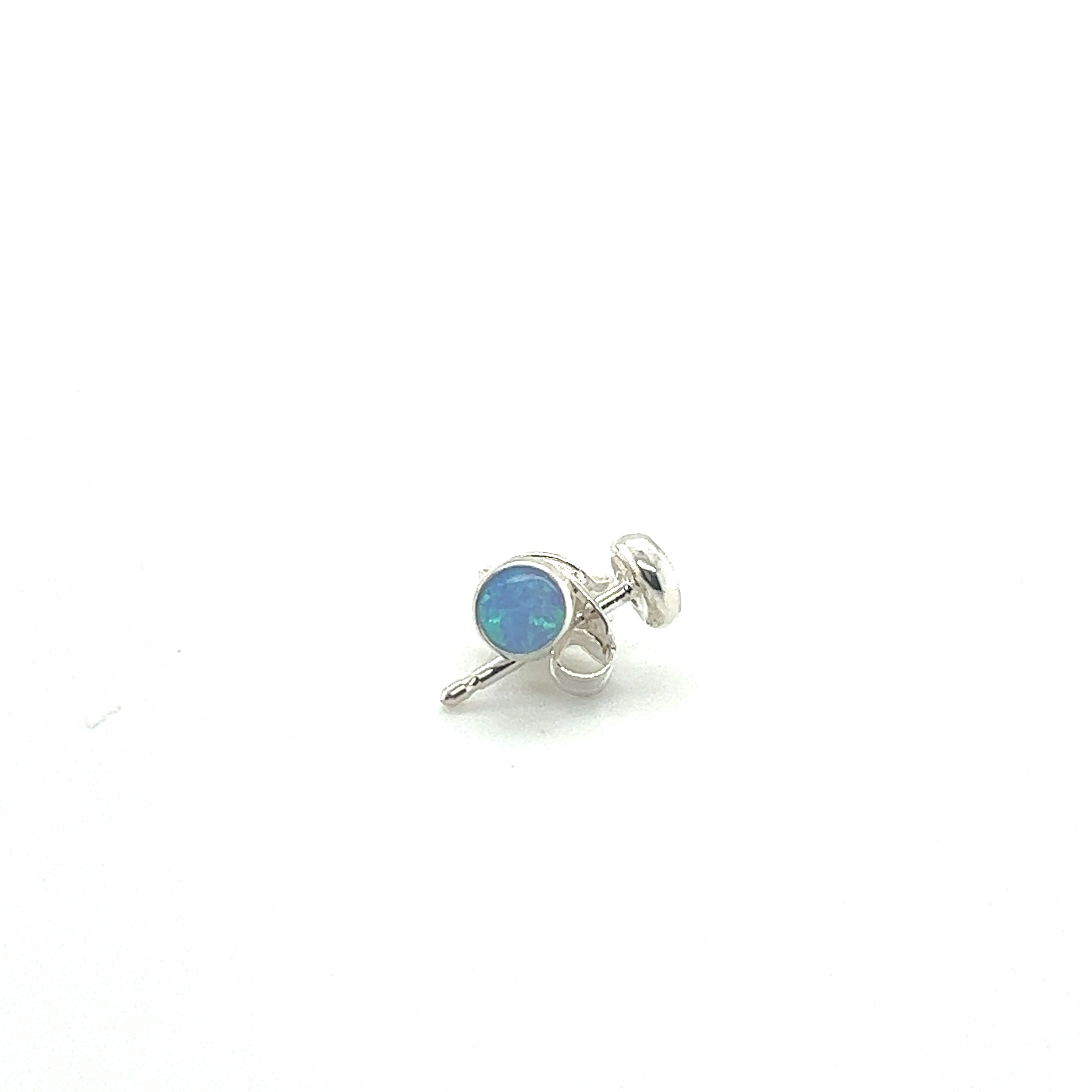 A minimalist Super Silver Dainty Opal Stud earring made of sterling silver on a white background.