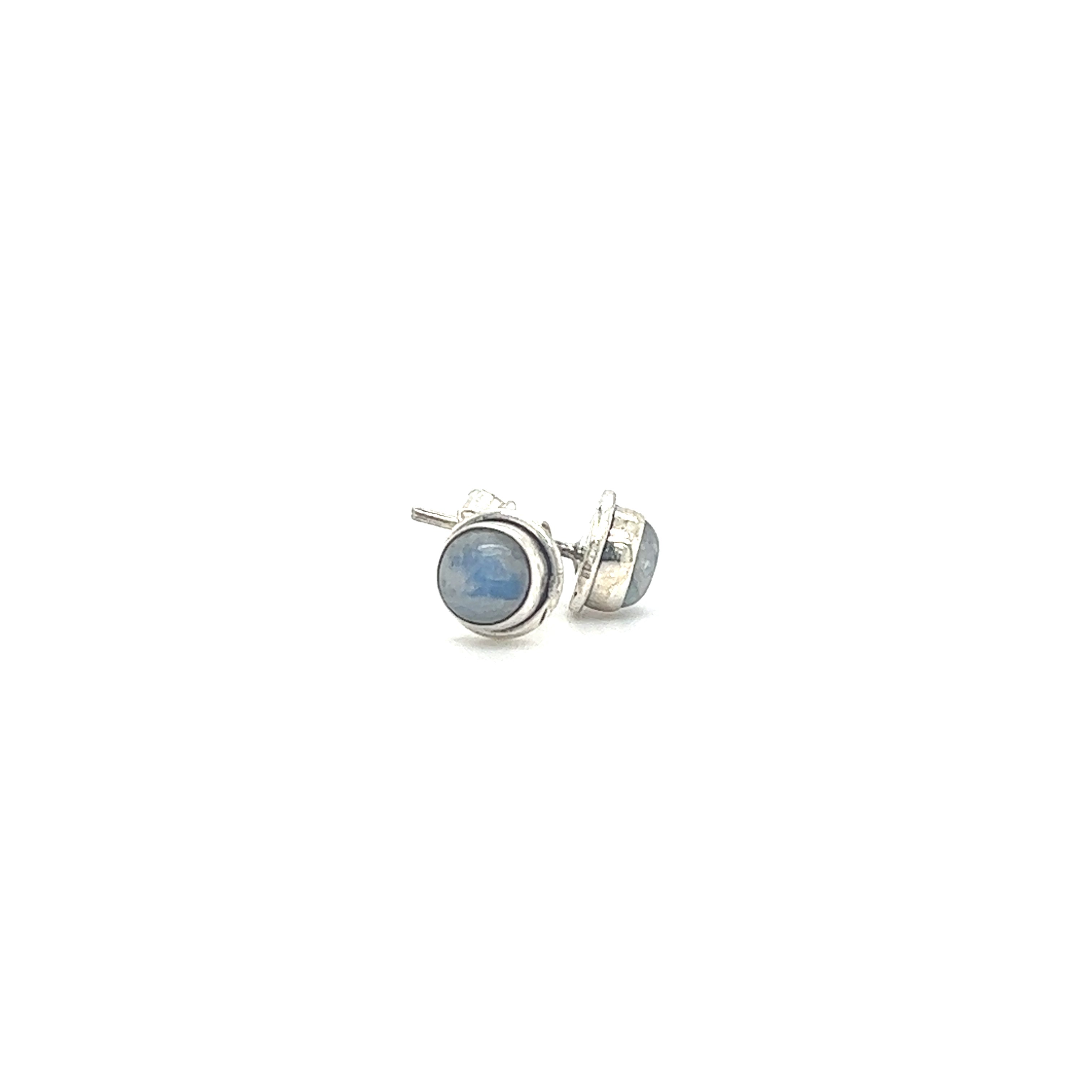 A pair of Super Silver's Simple Round Gemstone Studs with a blue stone in a bezel setting.
