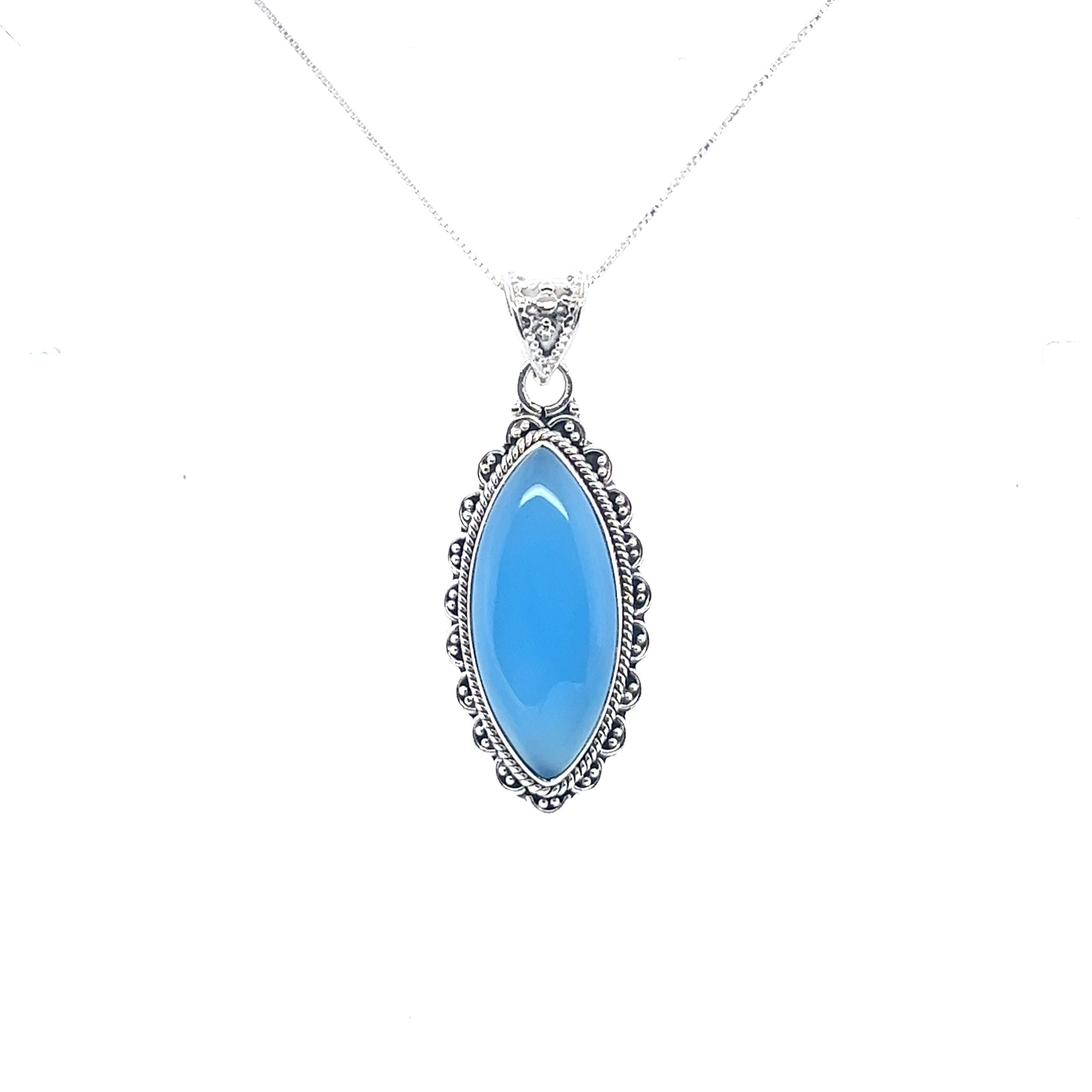 A Marquise Shaped Gemstone Pendant with a blue stone made of sterling silver from Super Silver.