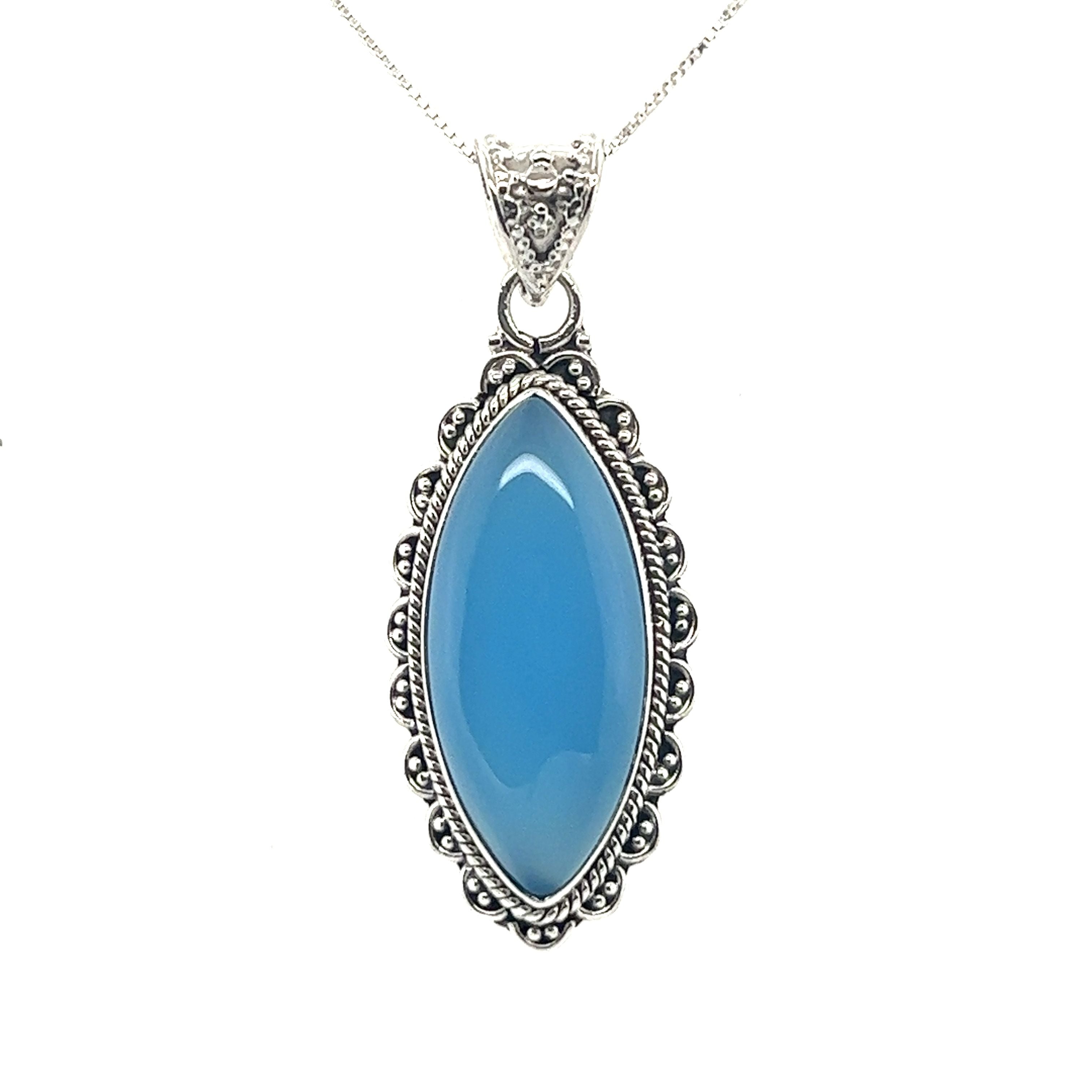 A Marquise Shaped Gemstone Pendant on a Super Silver chain, showcasing the vibrant color of the stone.