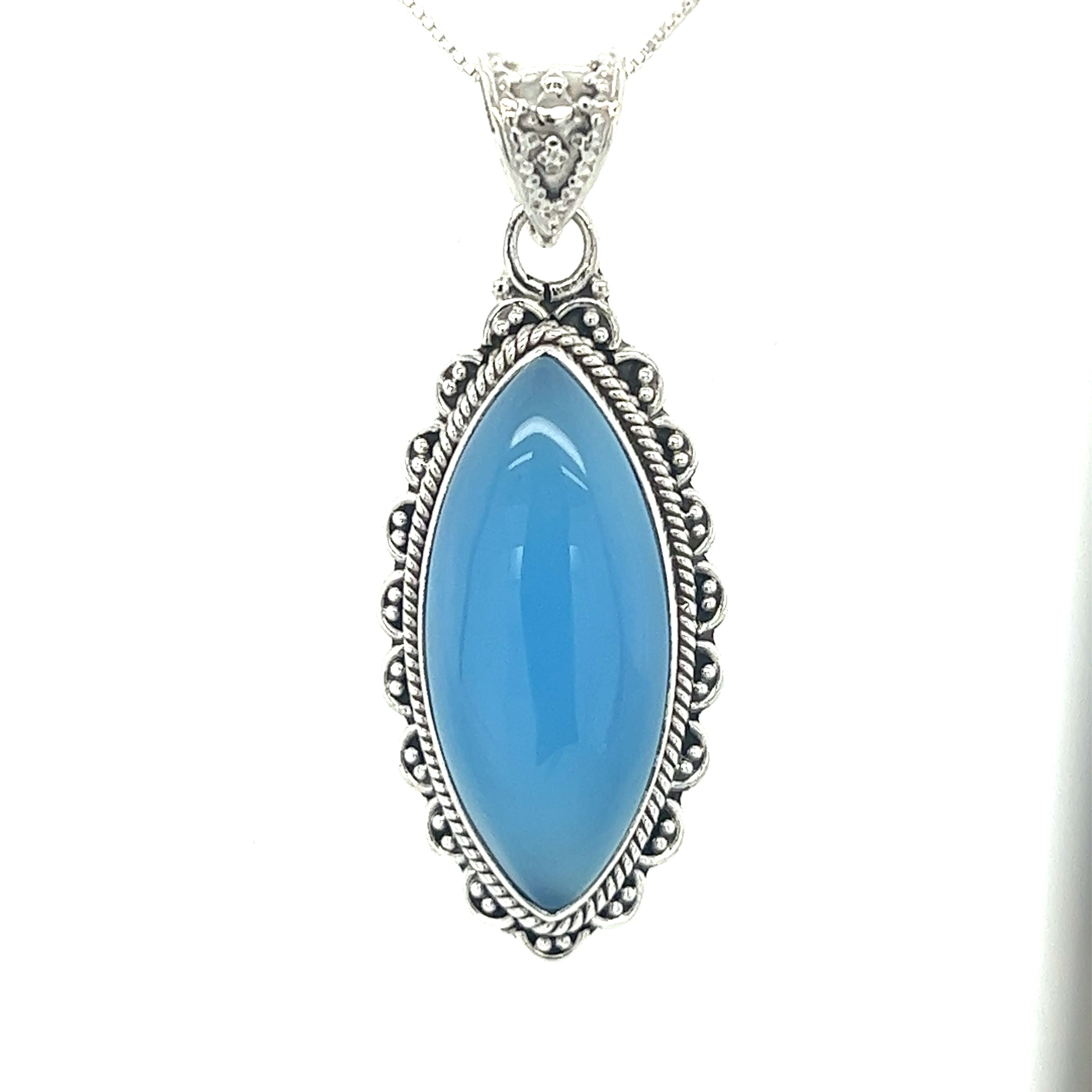 A Marquise Shaped Gemstone Pendant adorned with a vibrant blue chalcedony stone by Super Silver.