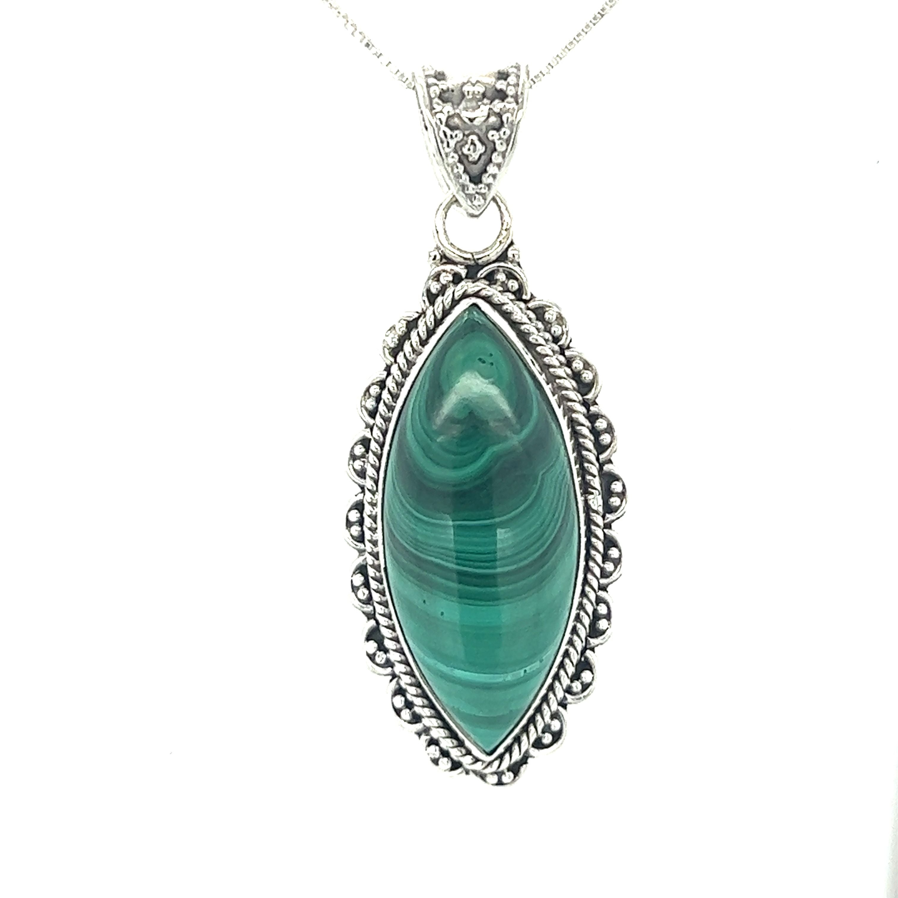 A Marquise Shaped Gemstone Pendant on a silver chain. This exquisite pendant showcases the vibrant color of the malachite stone, elegantly displayed on a dainty silver chain from Super Silver.