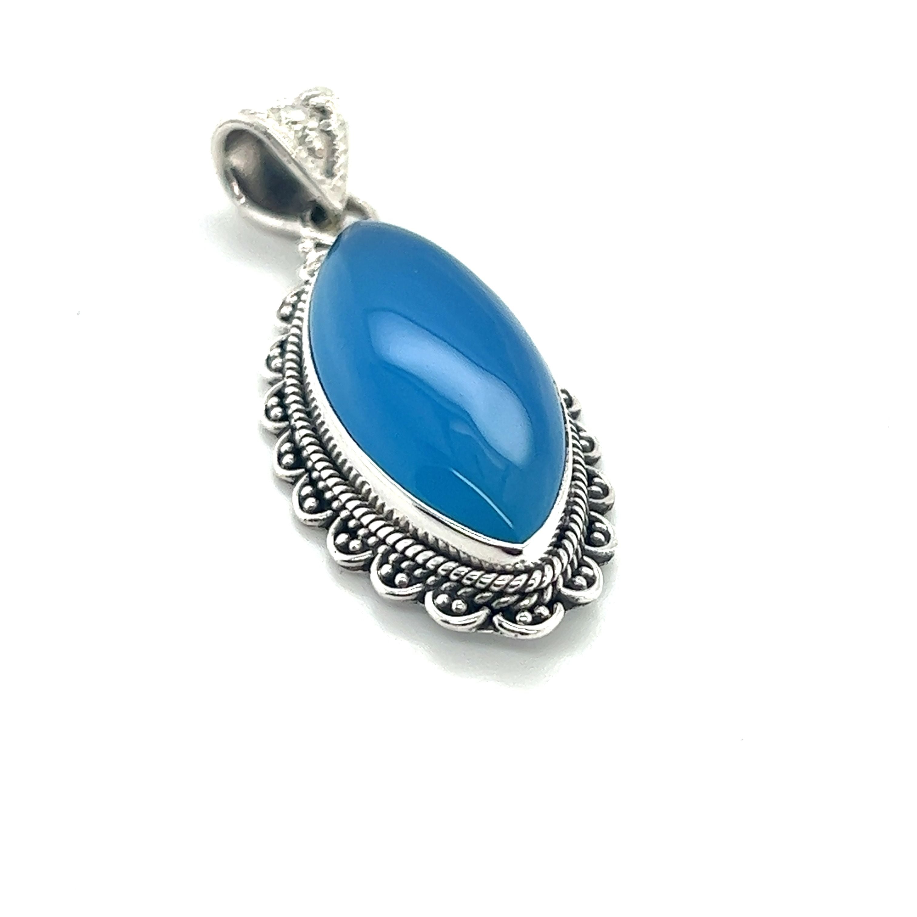 A Super Silver Marquise Shaped Gemstone Pendant with a blue chalcedony stone. This pendant features a beautiful blue color.