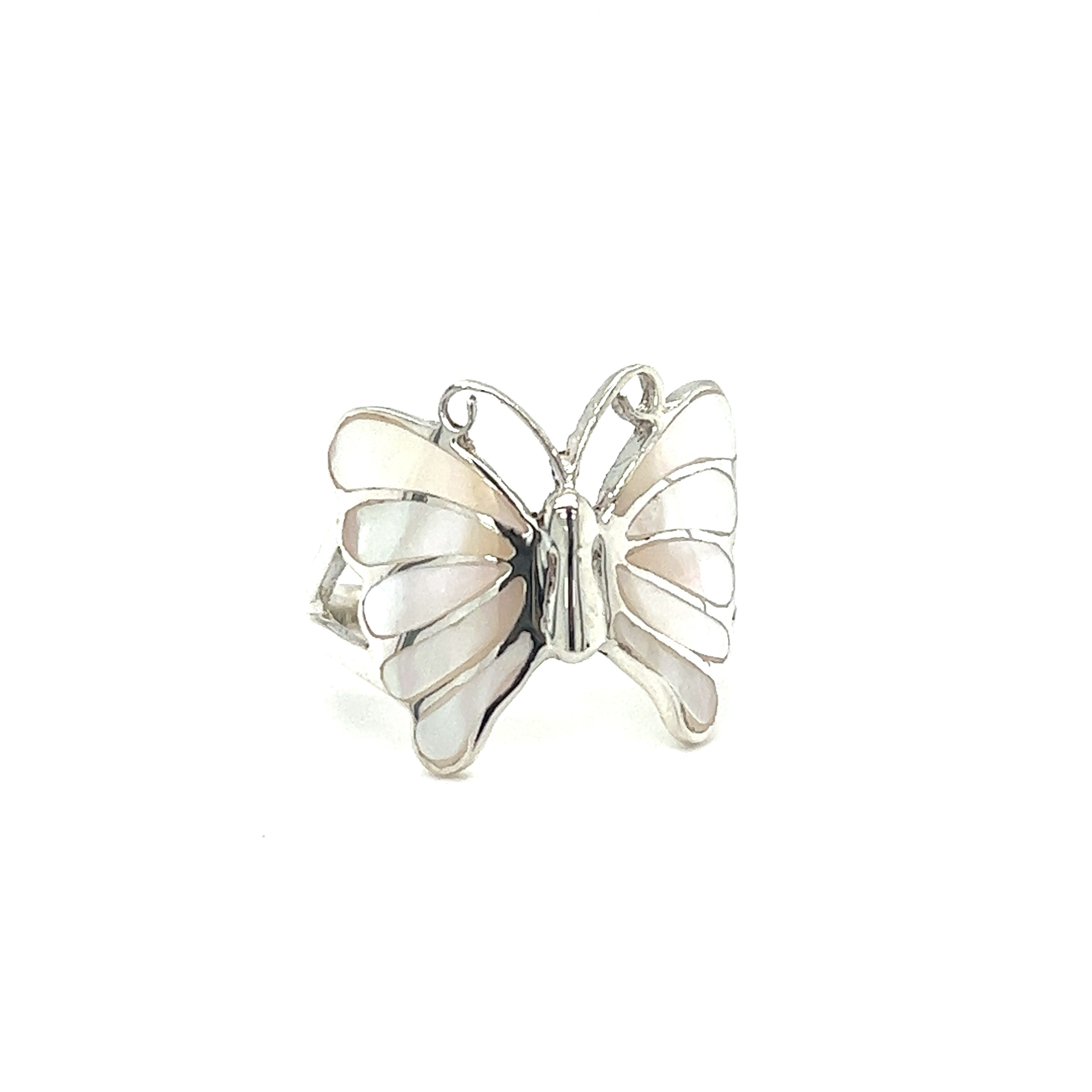 A statement Elegant Butterfly Inlay Ring with Swirly Antennae on a white background.