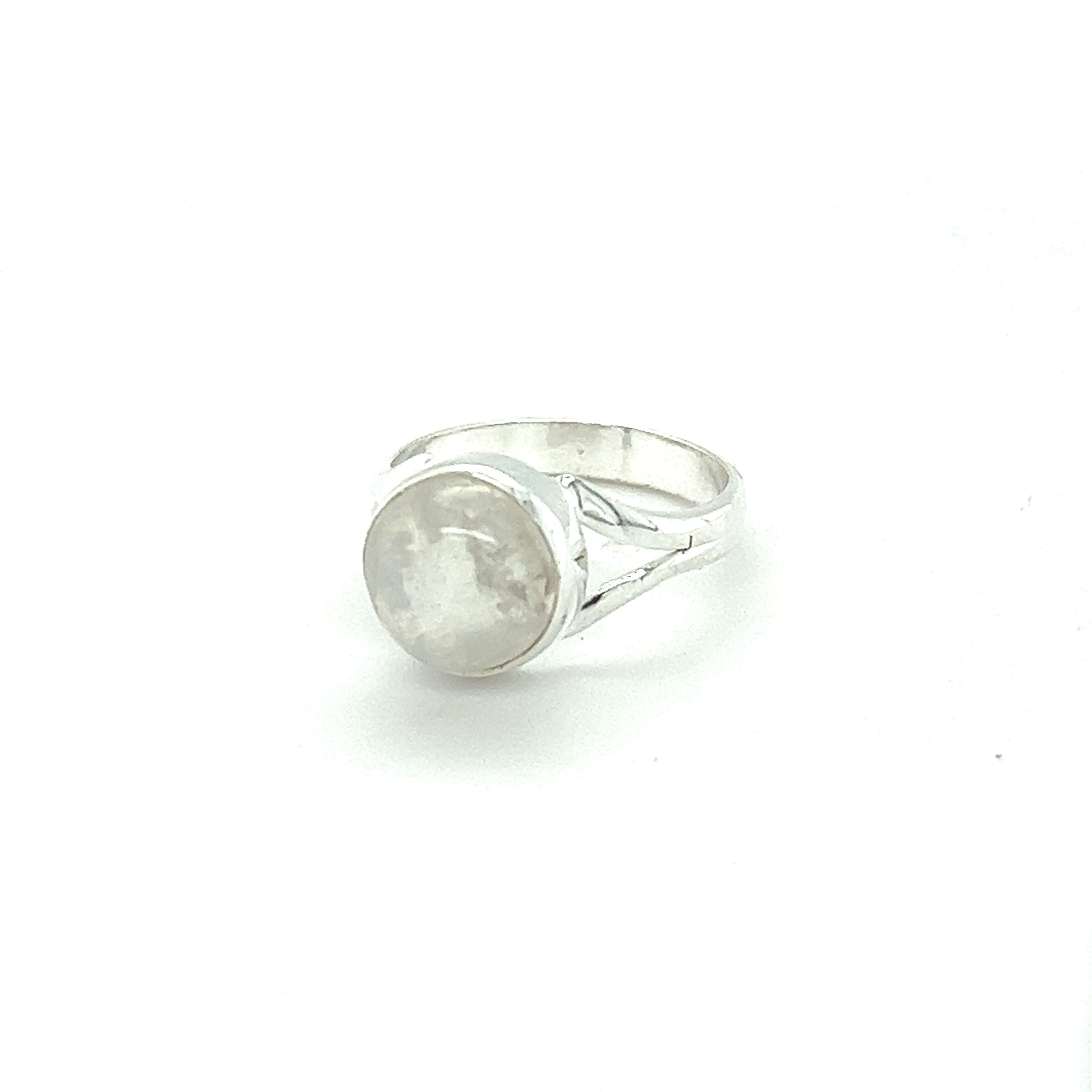 A Simple Vibrant Circular Stone Ring with a vibrant white stone in the middle from Super Silver.