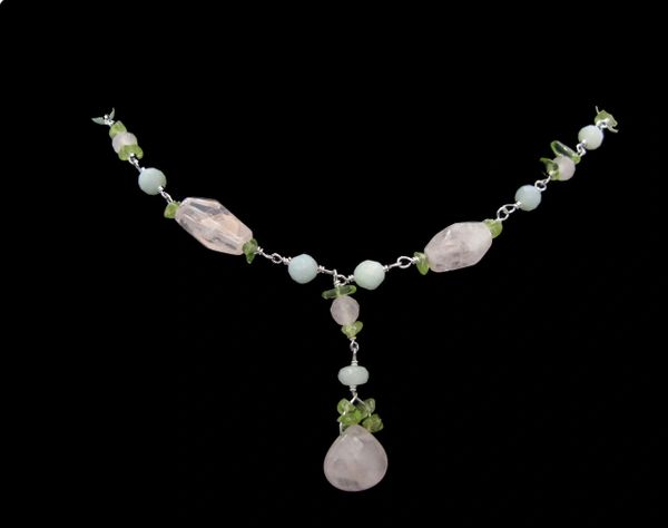 
                  
                    A Beaded Multicolor Y-necklace adorned with pink quartz and green emeralds by Super Silver.
                  
                