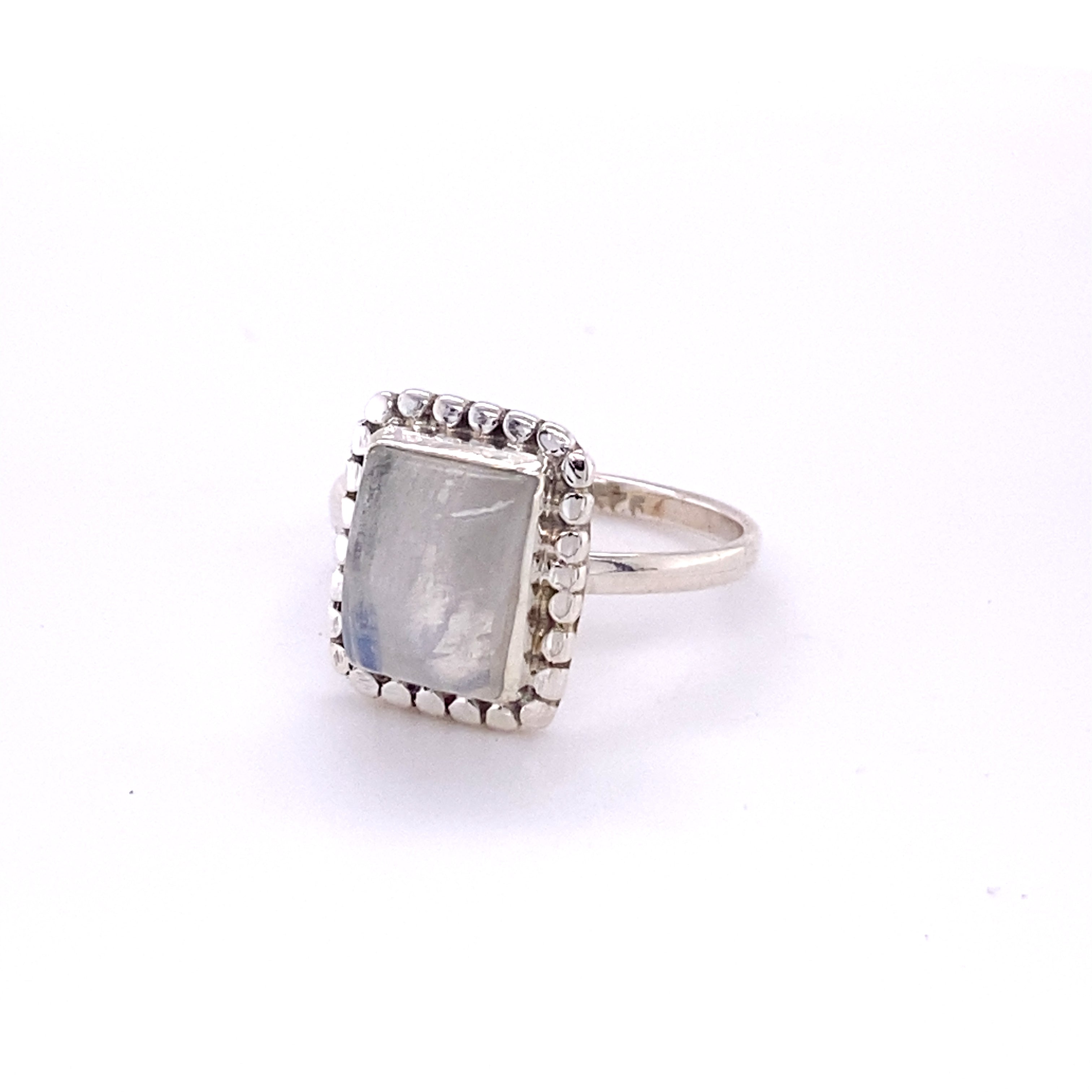 Square ring with natural gemstones in sterling silver. This boho-inspired piece features a mesmerizing cabochon moonstone set in a shiny sterling silver band. Perfect for the free-spirited hippie at heart