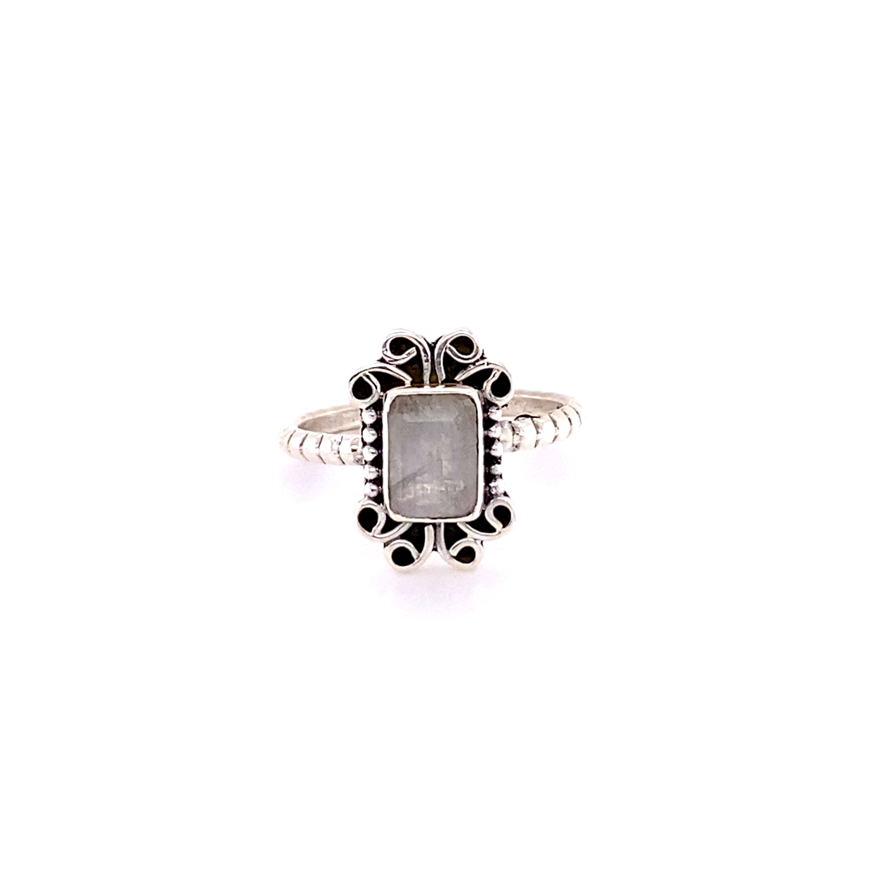 An indie Natural Gemstone Square Ring with Swirls with a white cabochon stone in the center.