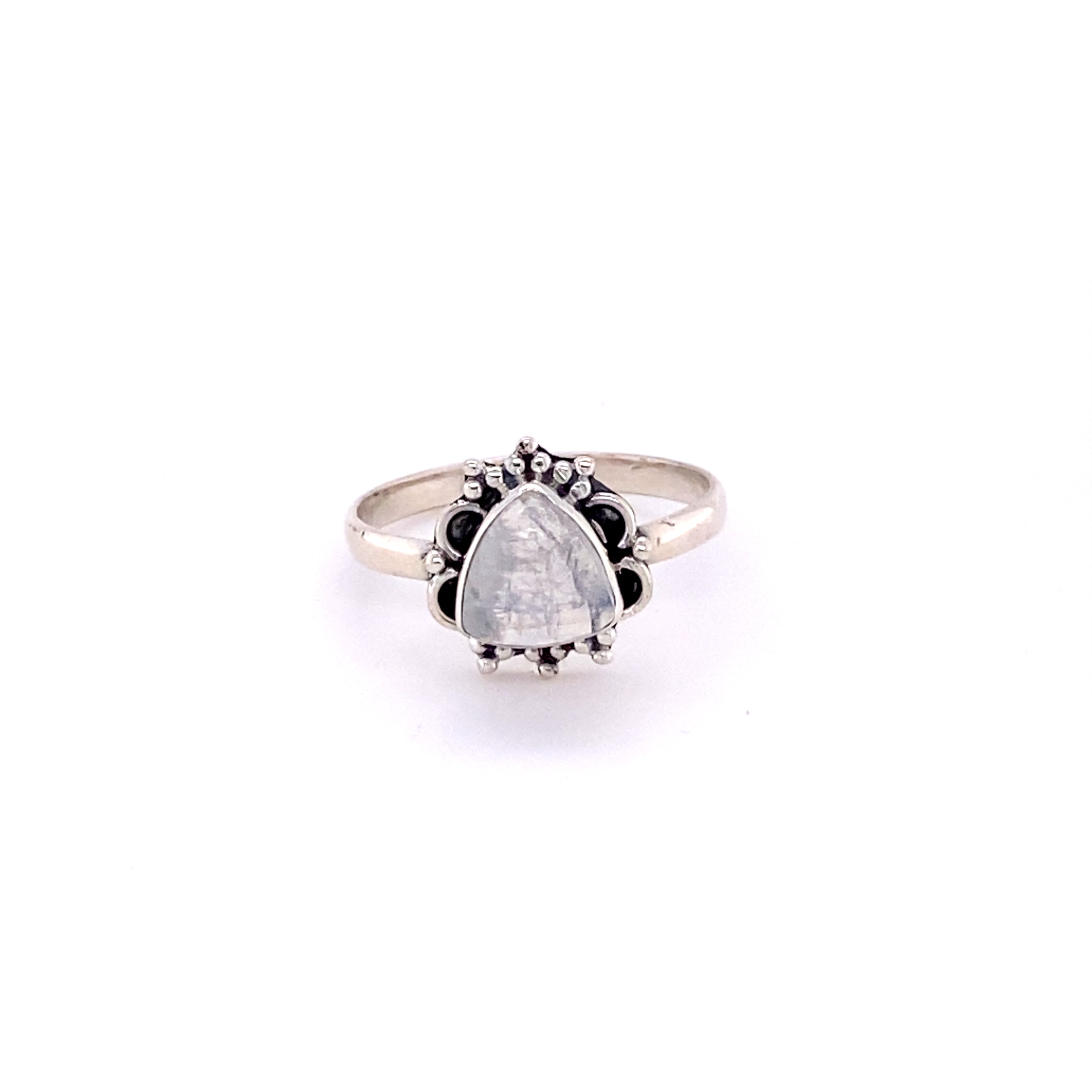 A Triangular Gemstone Ring with Frills on a white background.