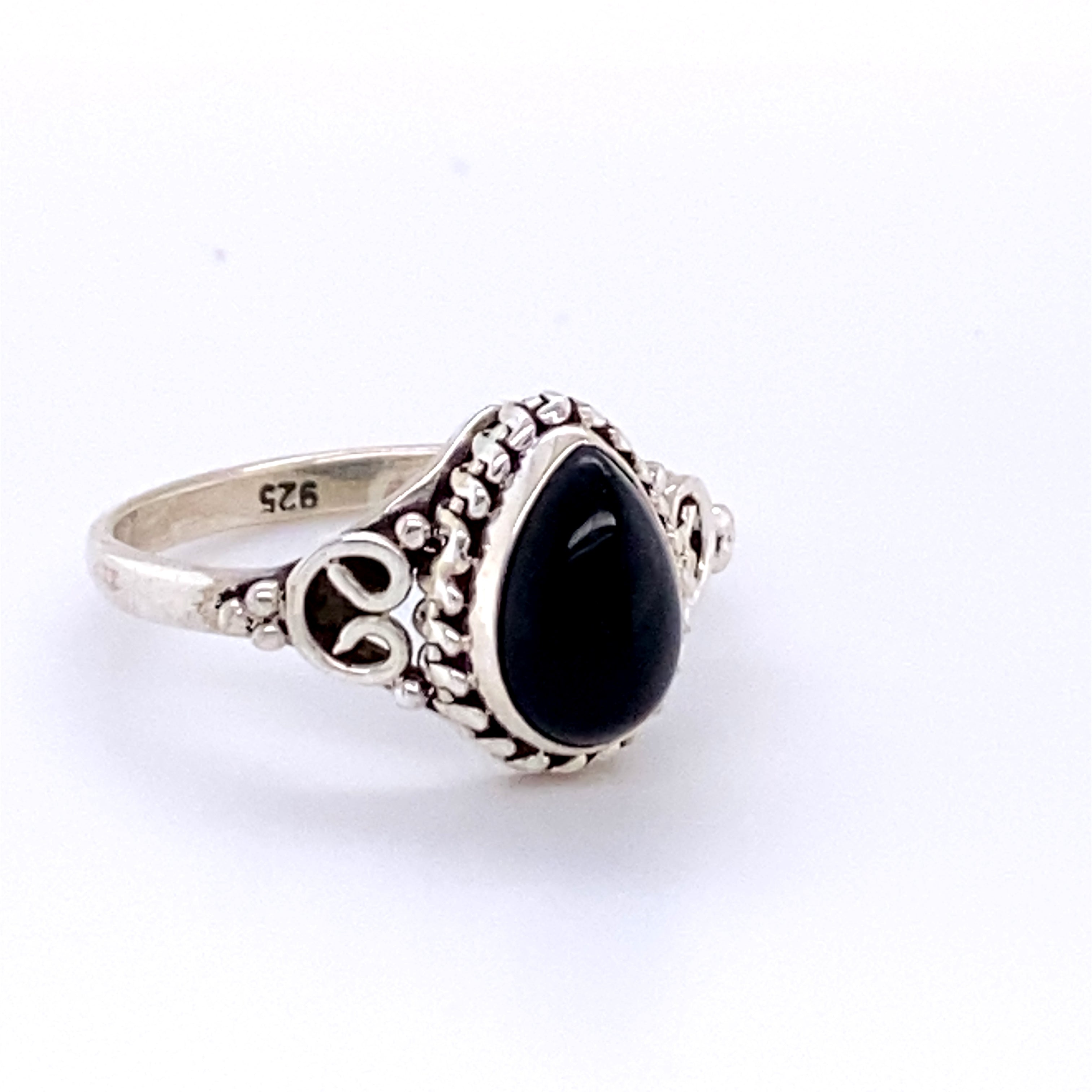 A boho-inspired Teardrop Gemstone Ring with Intricate Ball Border.