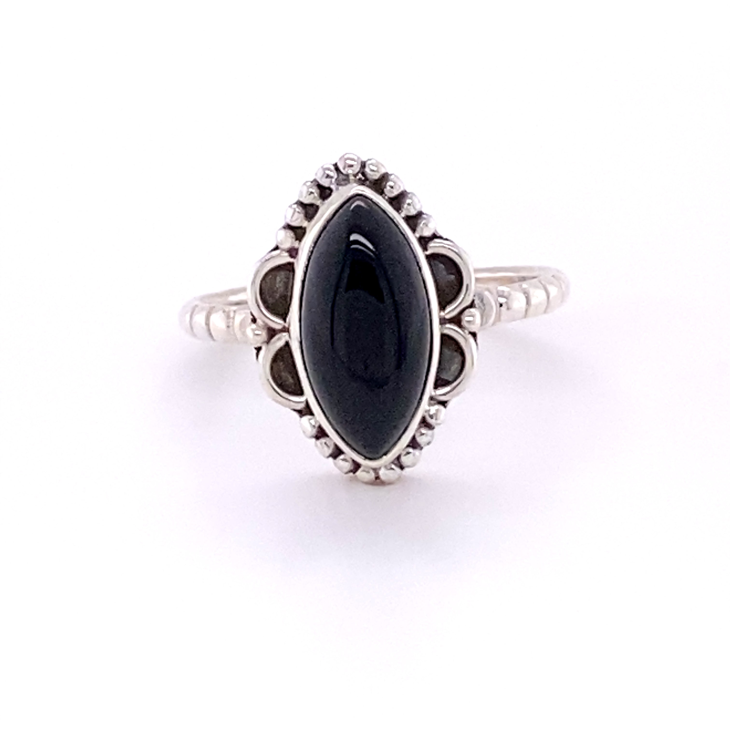 A Marquise Shaped Gemstone Ring with Ball Border and Textured Band with a black onyx stone.