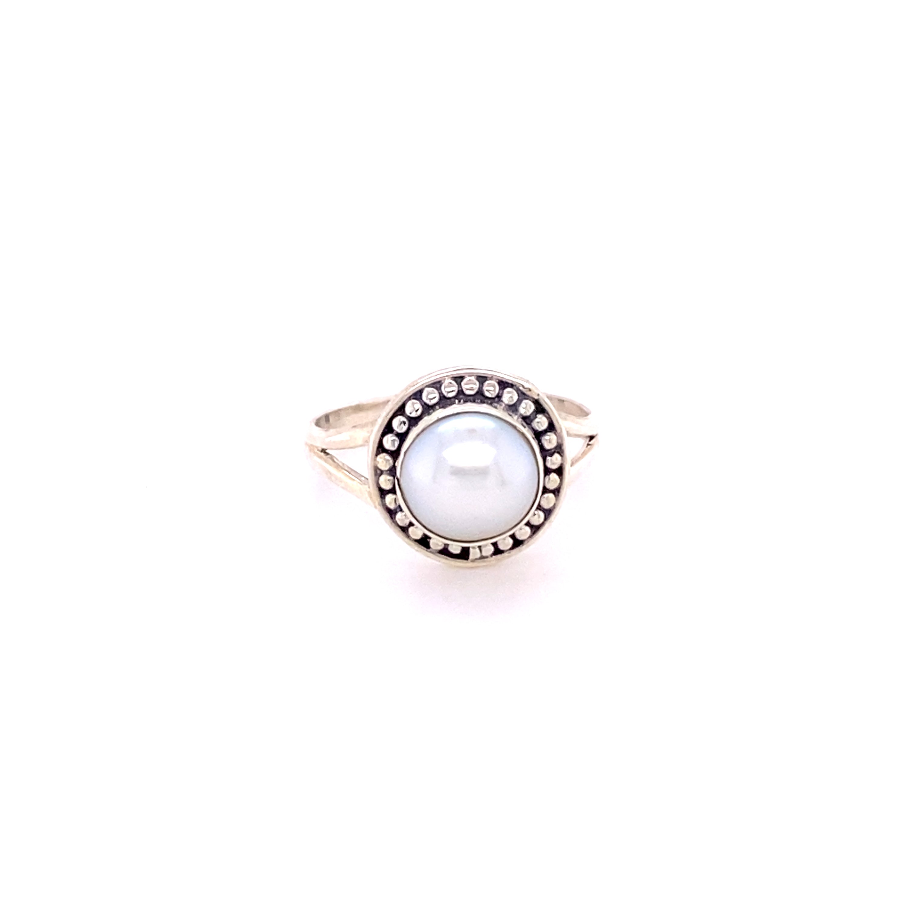 A white Trendy Oval Ring and diamond ring on a white background. Made with .925 Sterling Silver, this Super Silver shield stone ring showcases the beauty of various stones.