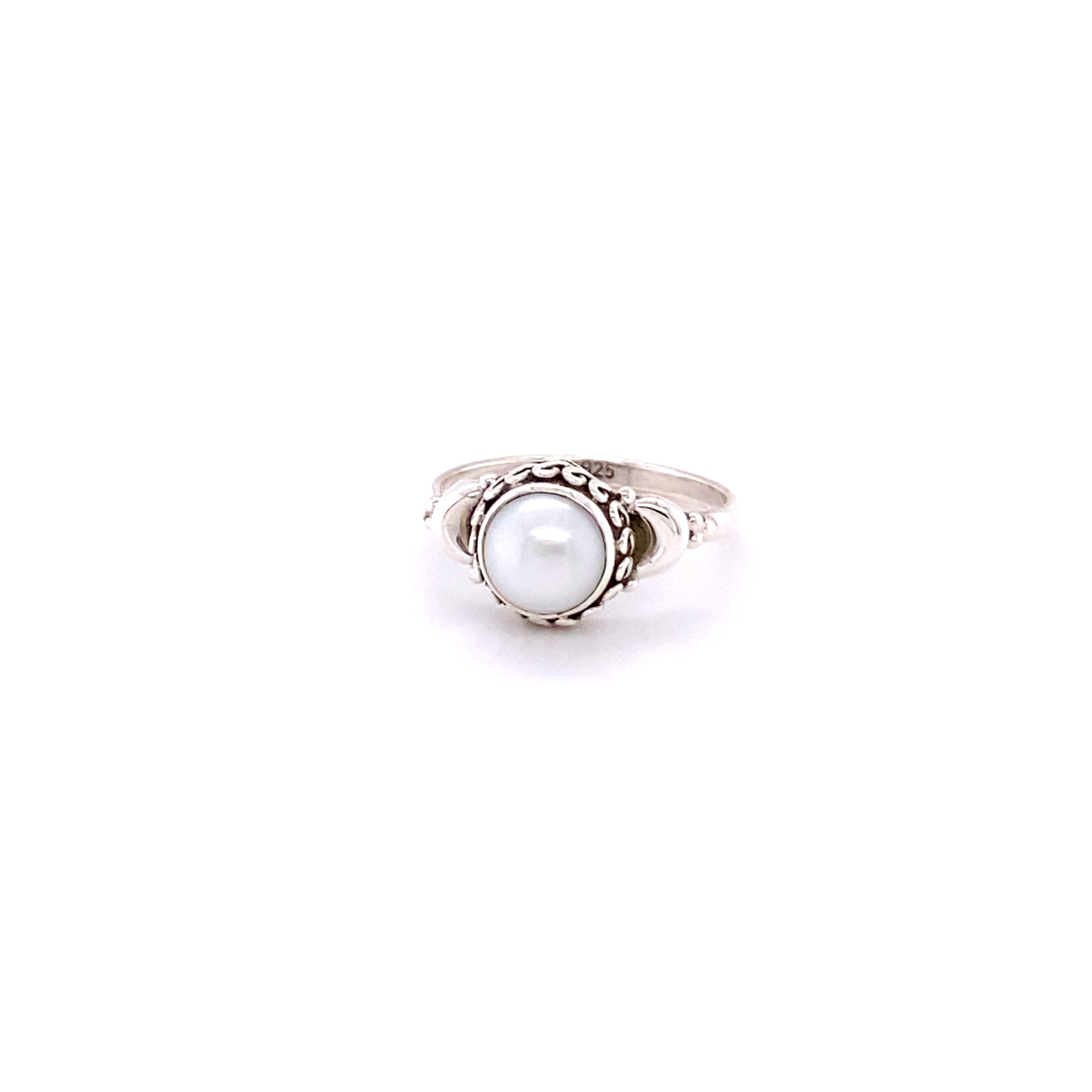 A beautiful Oval Gemstone Ring with Small Moons set in sterling silver on a white background.