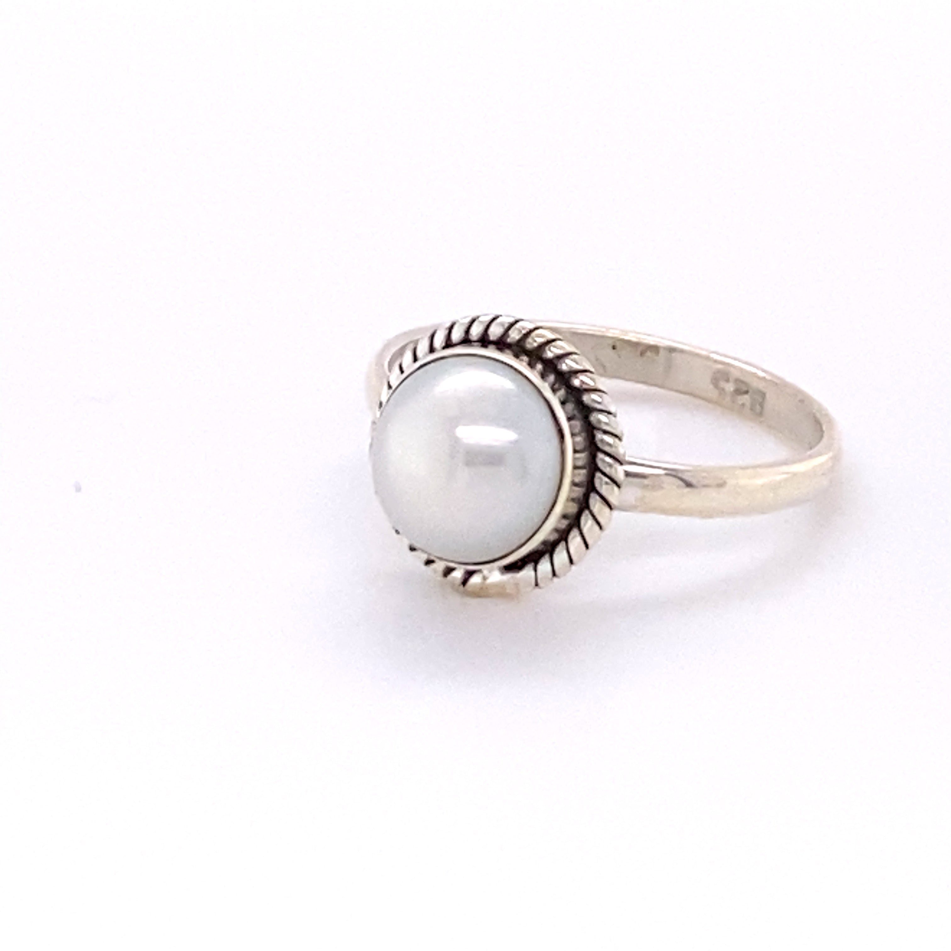 A Super Silver Simple Round Gemstone Ring with Rope Border stacker on a white background.