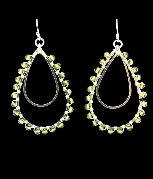 Super Silver Peridot Tear Drop Shaped Dangle Earrings adorned with silver beads.