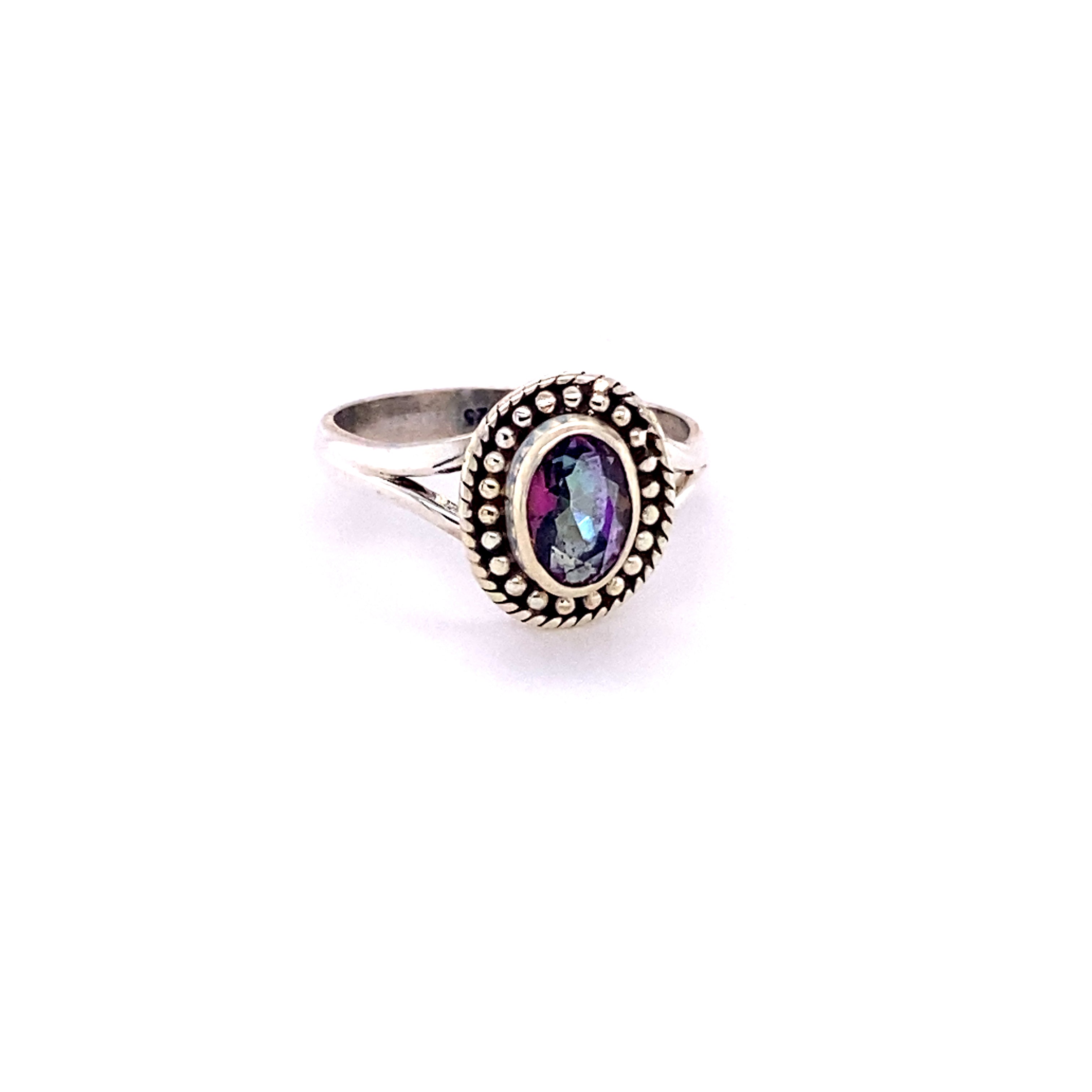 An Oval Gemstone Ring with Ball Disk Rope Border with a black cabochon stone in the center.