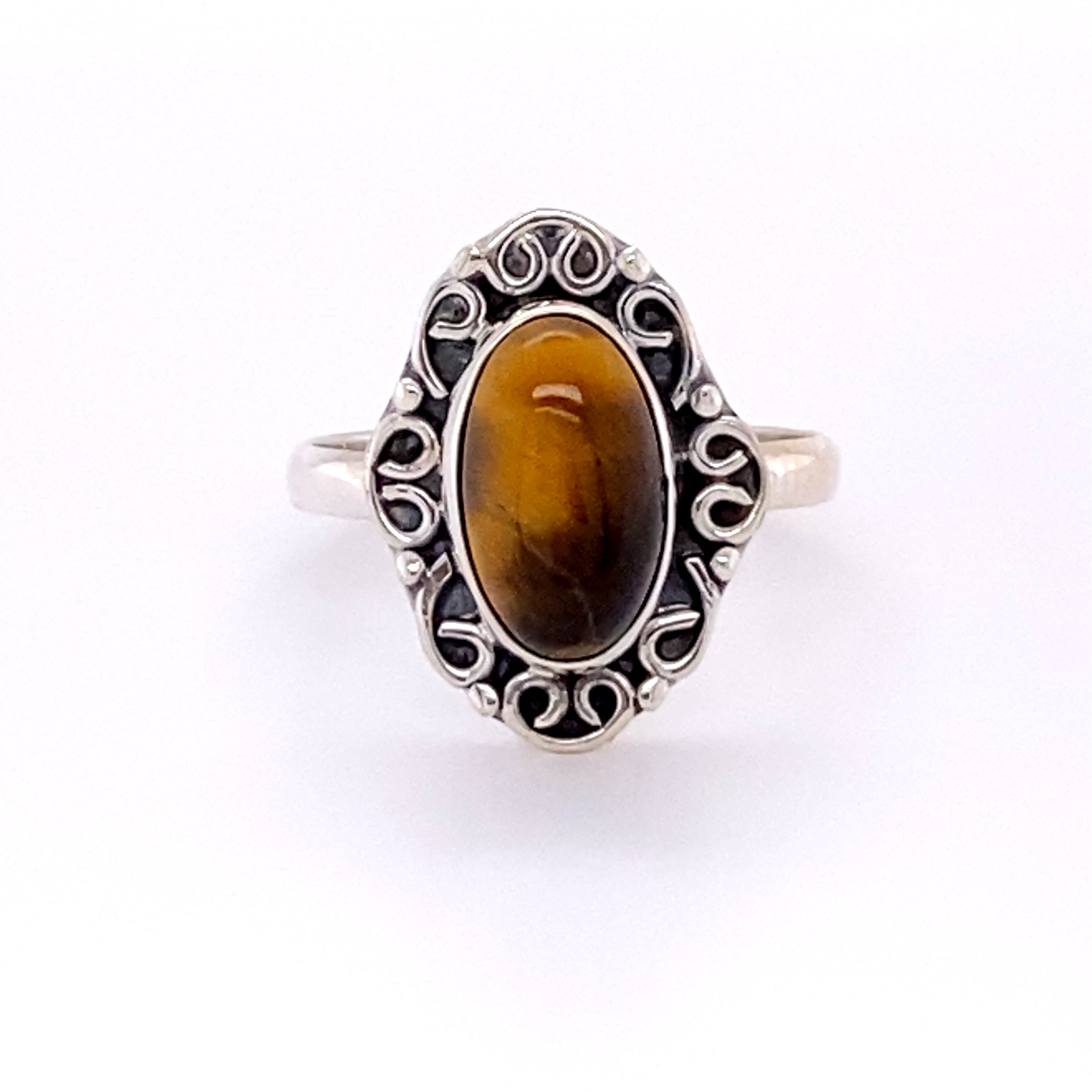 A silver Oval Gemstone Ring with Swirl Filigree Border, giving off a Santa Cruz hippie vibe.