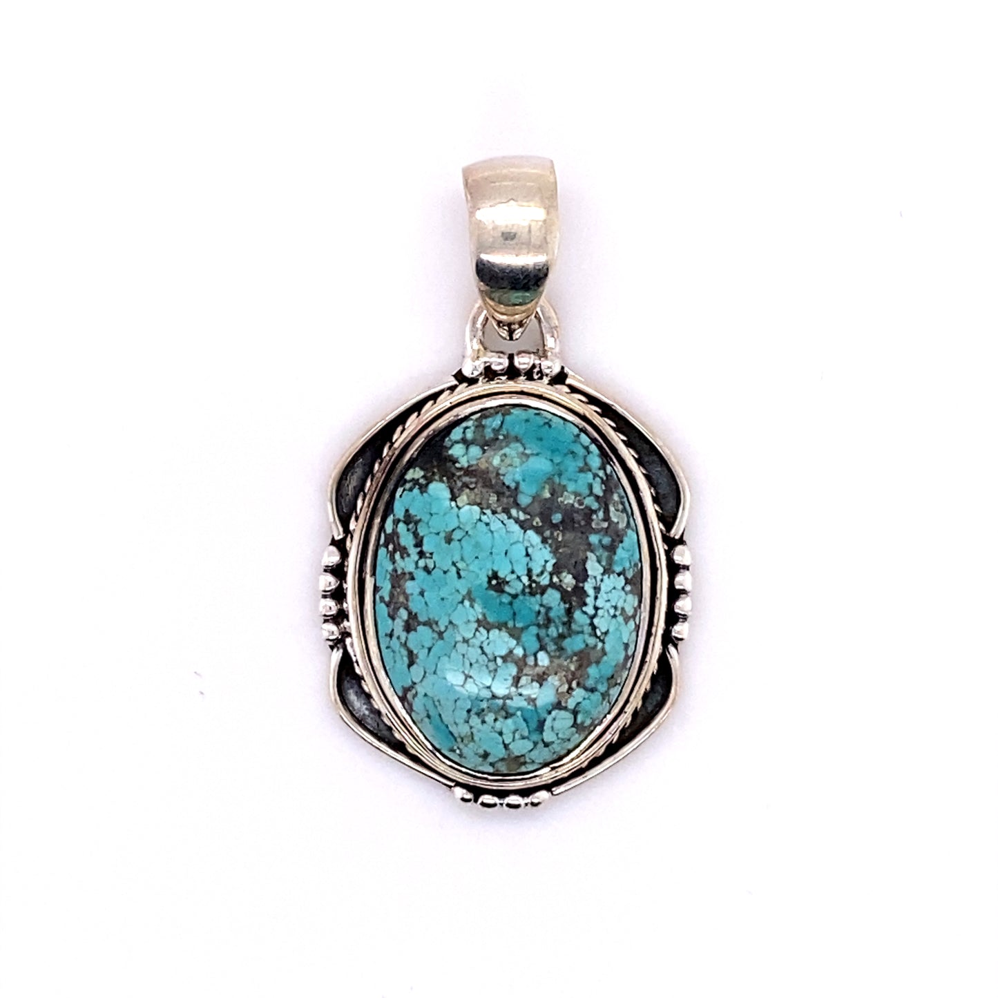 
                  
                    A Super Silver handmade sterling silver pendant adorned with a stunning Natural Turquoise Pendant with an Oval Shield Setting.
                  
                