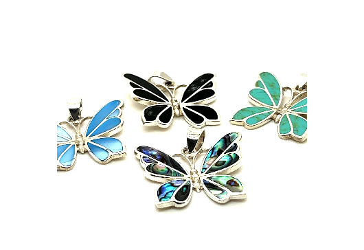 Four Medium Inlay Butterfly Pendants in various colors, including blue, black, turquoise, and a multi-colored design, artfully crafted in sterling silver and gemstone jewelry, displayed against a white background.