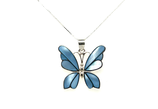 A Medium Inlay Butterfly Pendant featuring a blue butterfly against a white background. The butterfly pendant is beautifully outlined in silver, making it a standout piece of gemstone jewelry.