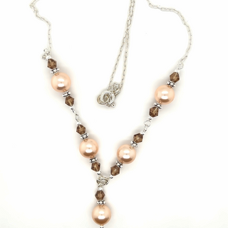 A Super Silver necklace with shell pearls and Swarovski crystals.
