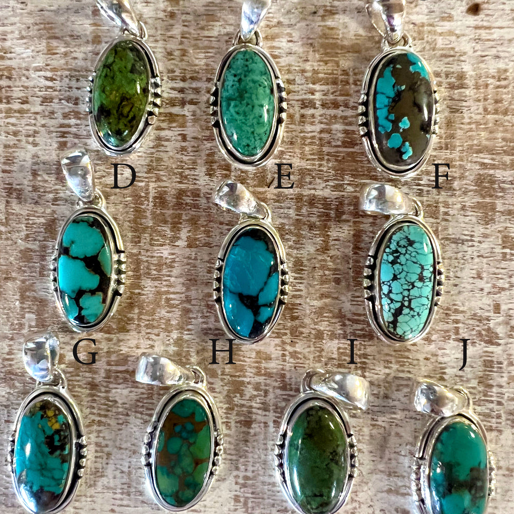 Handmade Natural Turquoise Elongated Oval Pendants on a Super Silver sterling silver chain.