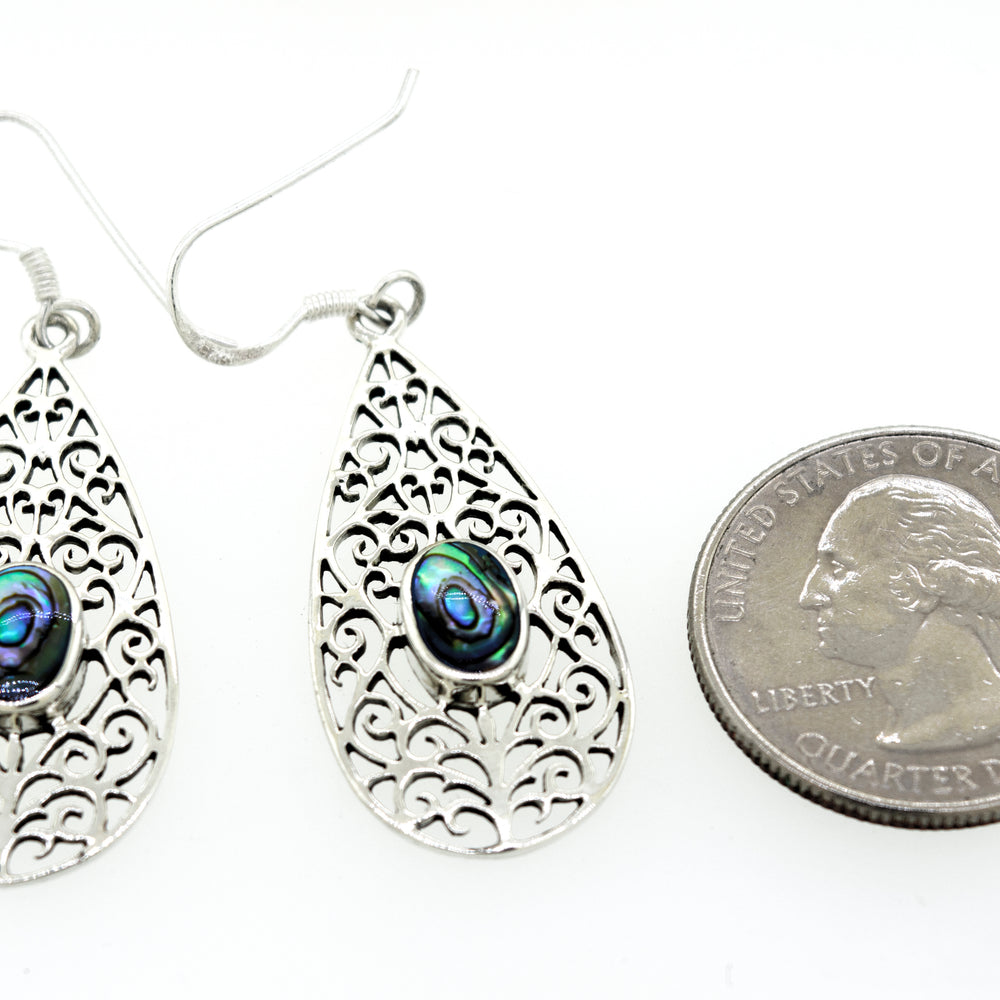 
                  
                    These stunning Elegant Teardrop Shape Abalone Earrings are crafted from Super Silver.
                  
                