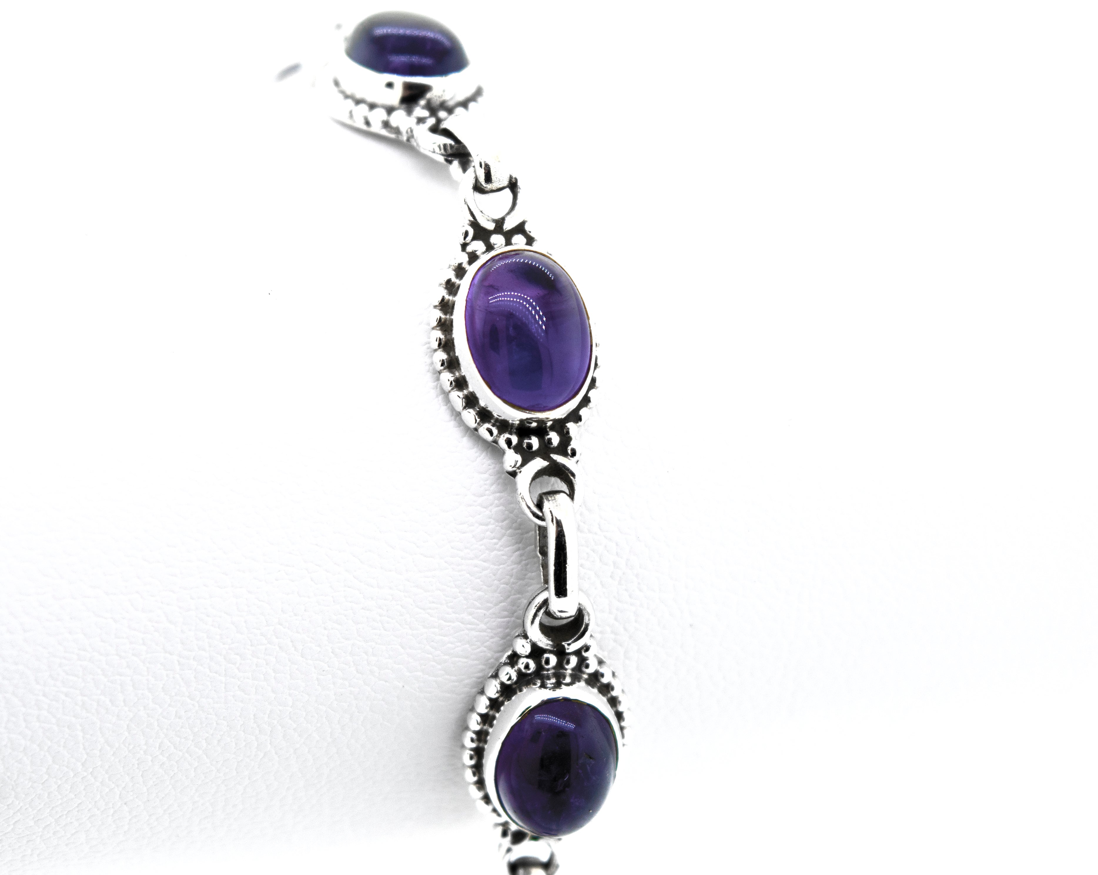 Amethyst Oval Gemstone Bracelet With Ball Border by Super Silver.