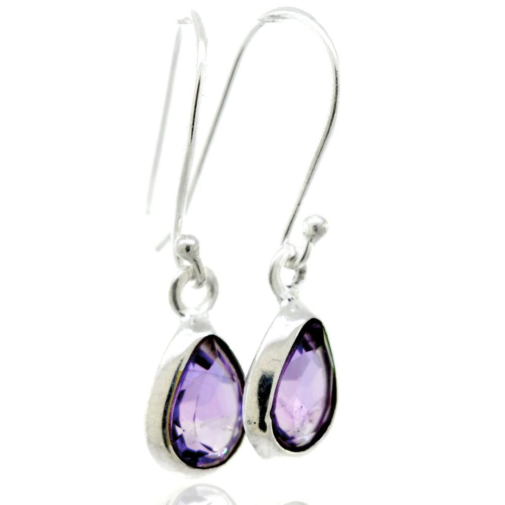 A stunning pair of Super Silver Simple Teardrop Shape Amethyst Earrings featuring a purple amethyst stone in a facet cut, set within a sterling silver setting.