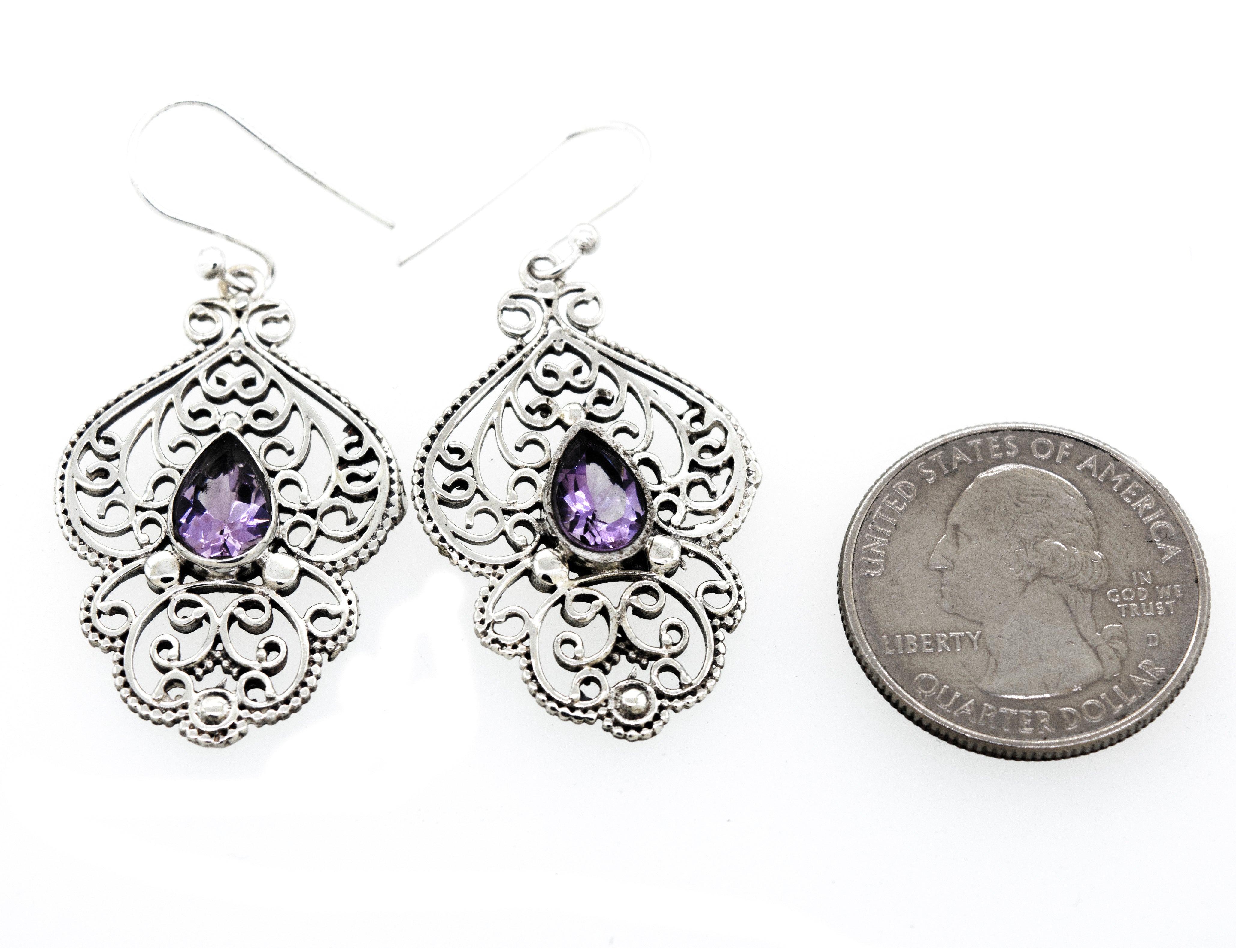 Super Silver teardrop amethyst earrings with freestyle silver design.