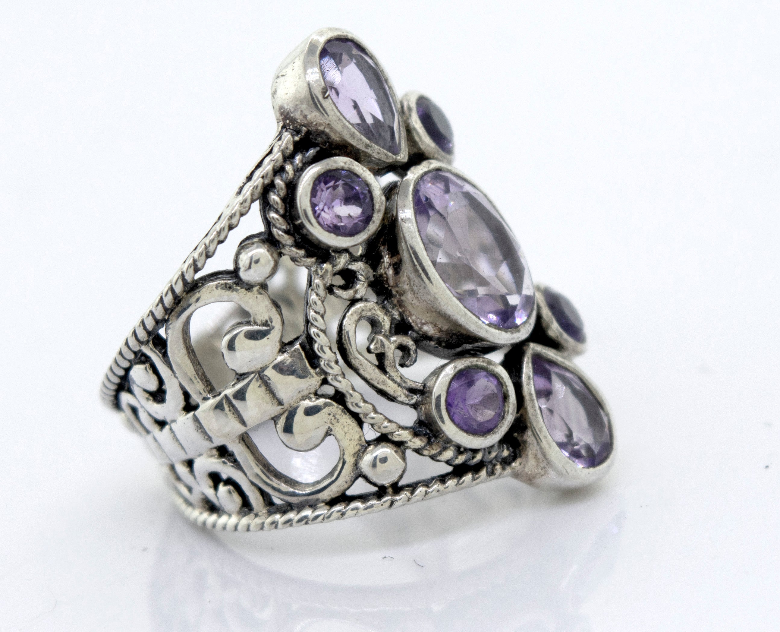 A Super Silver Amethyst Ring With Freestyle Design adorned with amethyst stones.