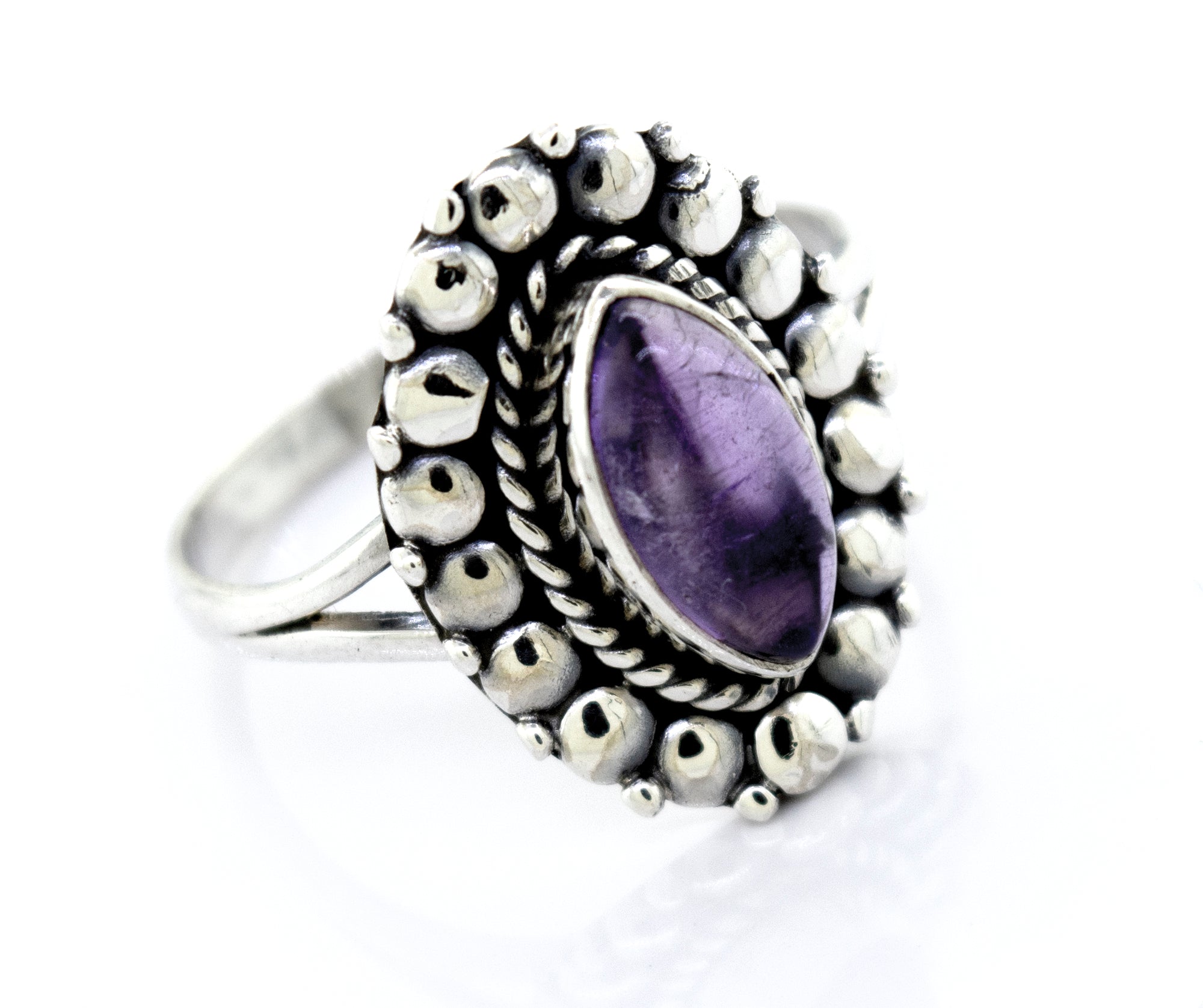 Super Silver Sterling silver ring with a Marquise Shaped Vibrant Amethyst Stone in a silver setting.
