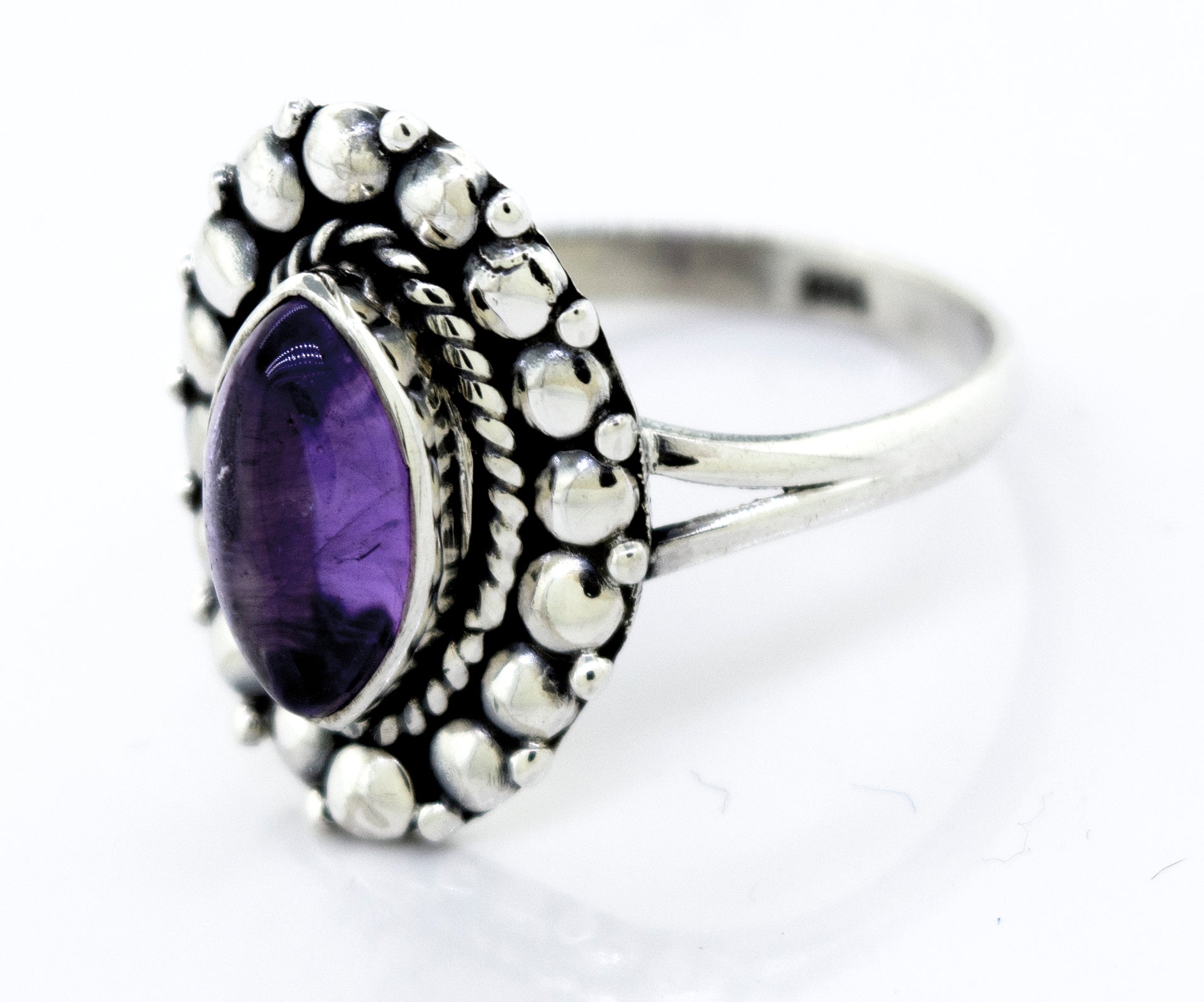 Beautiful Marquise Shaped Vibrant Amethyst Stone Ring in a Super Silver setting.