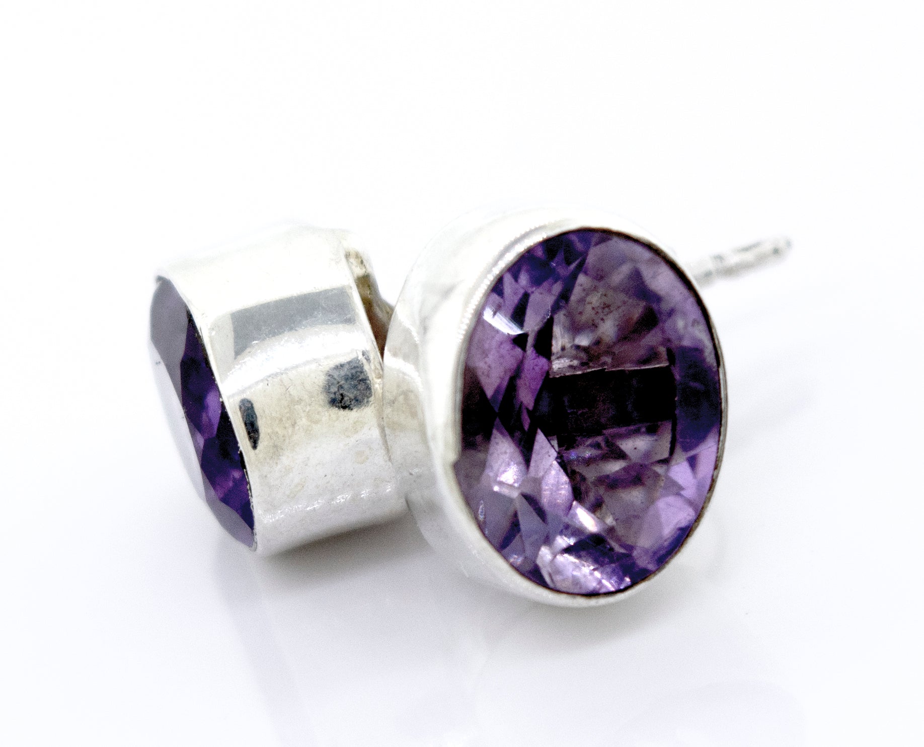 Beautiful Facet Cut Oval Amethyst Studs by Super Silver in sterling silver setting.