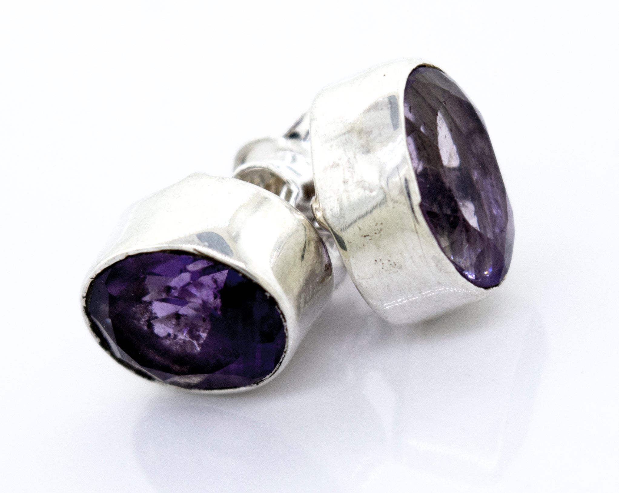 Beautiful Facet Cut Oval Amethyst Studs by Super Silver in a .925 sterling silver setting.