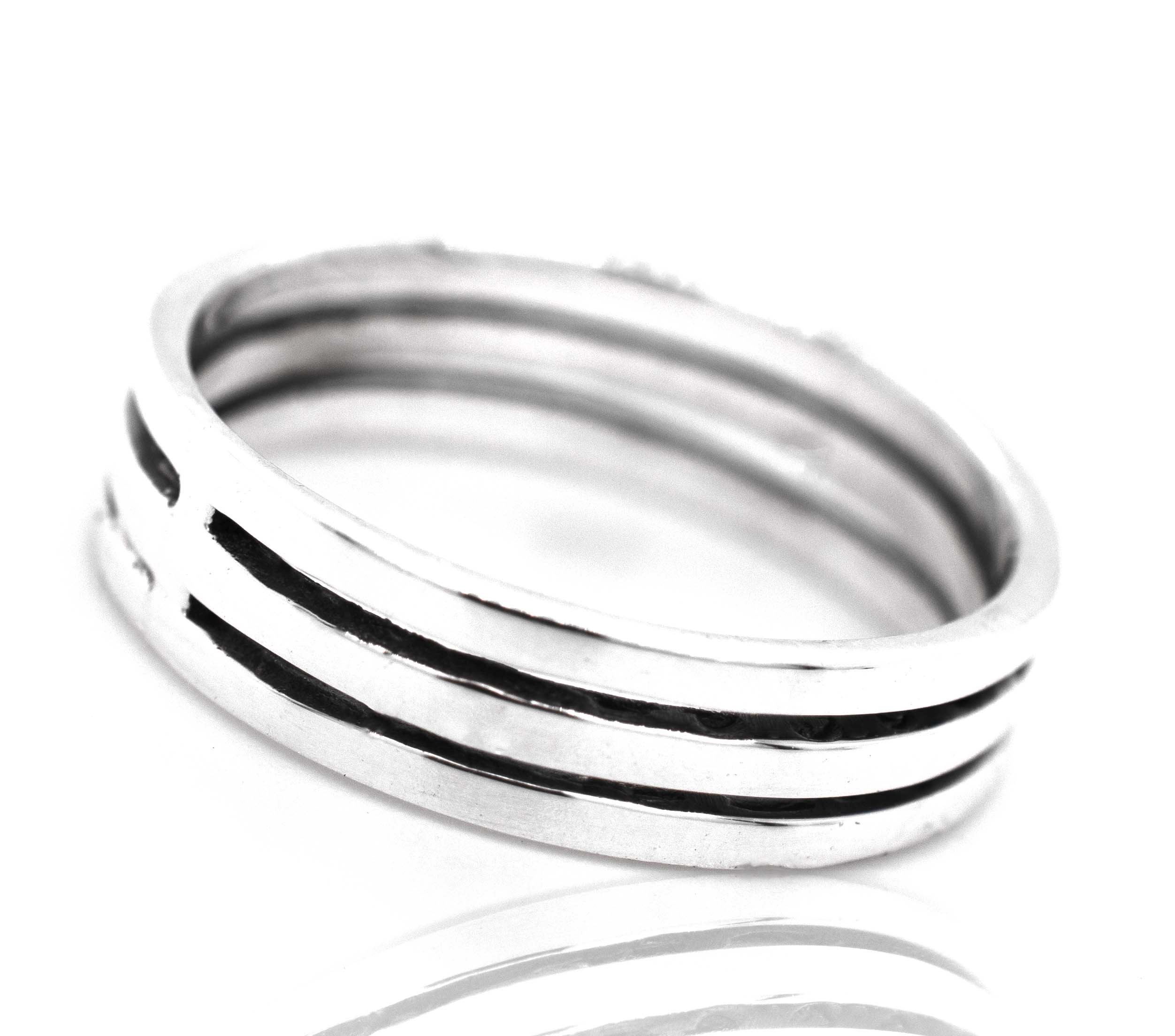 A Super Silver Triple Stripe Band with black stripes and cutouts on a plain silver band.