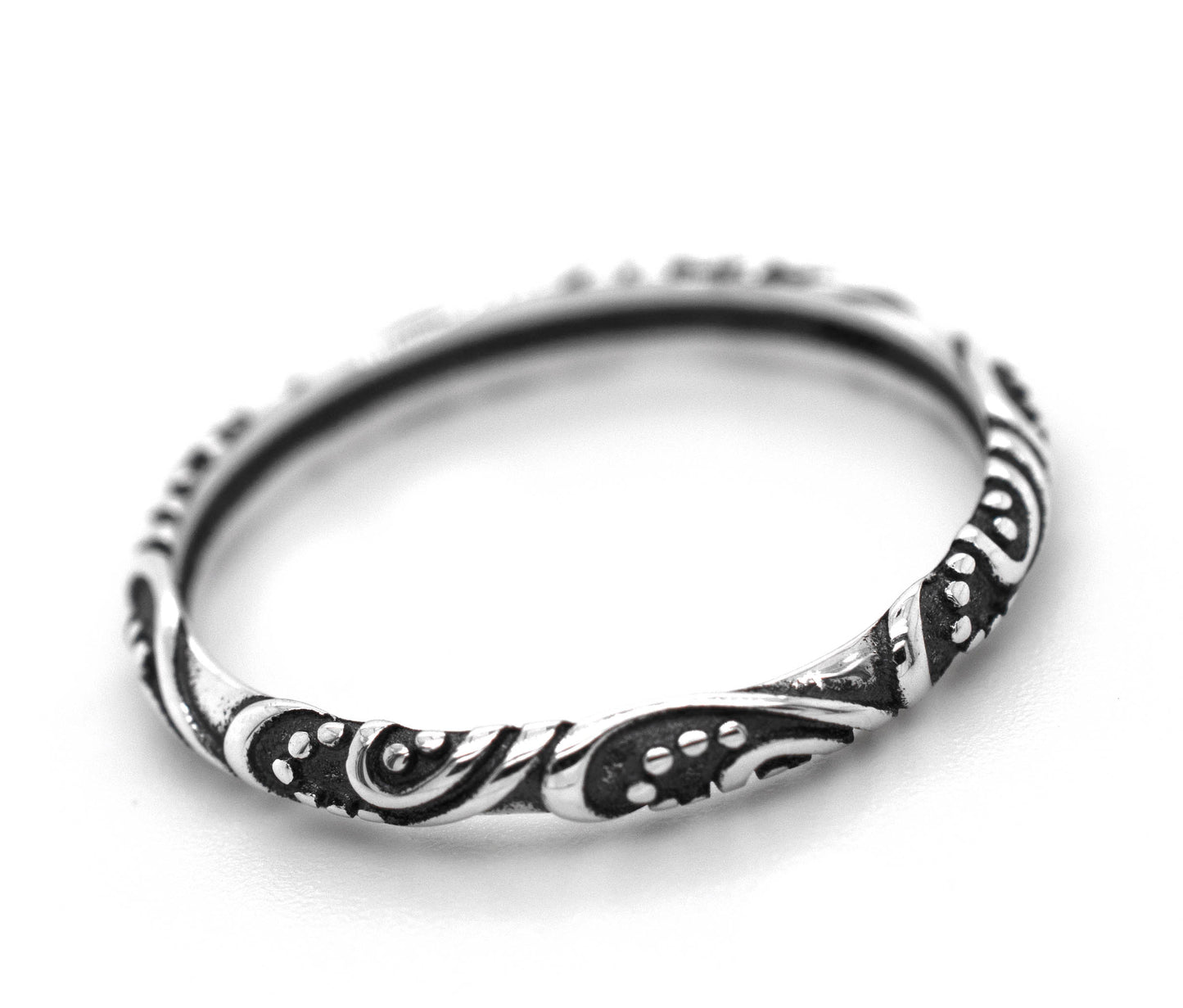 
                  
                    A Delicate Bali Style Band from Super Silver, made of .925 sterling silver with an ornate swirl design.
                  
                