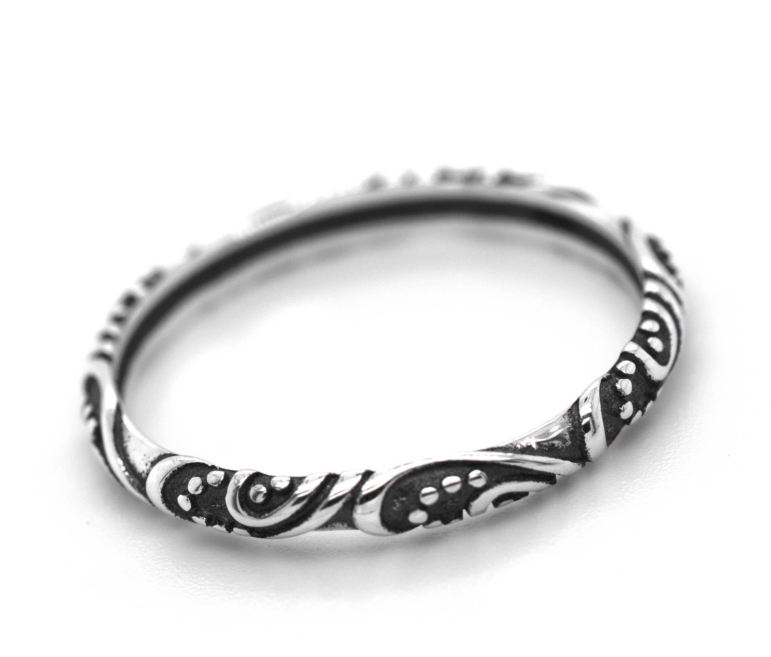 A Delicate Bali Style Band from Super Silver, made of .925 sterling silver with an ornate swirl design.