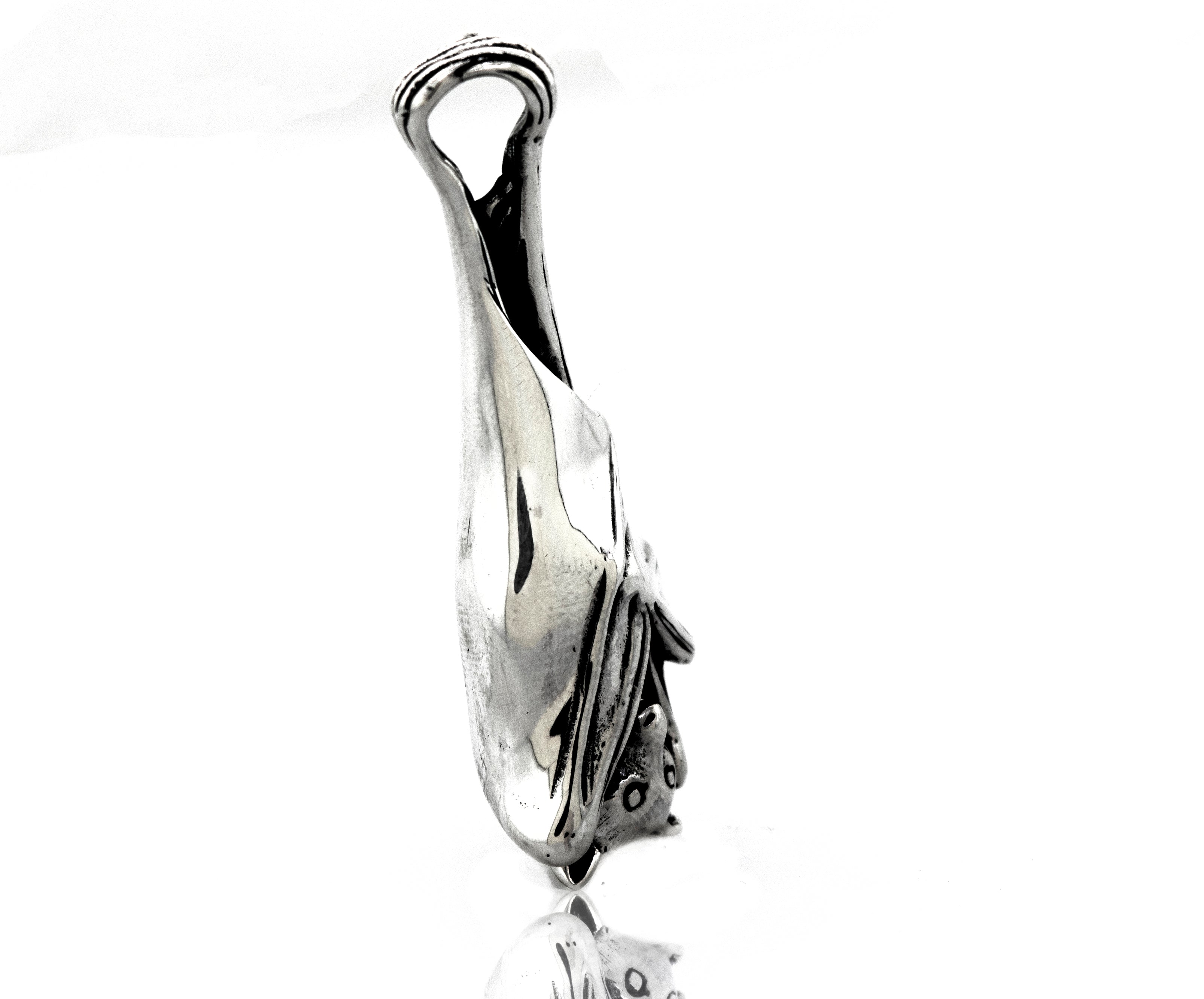 A Super Silver Designer Handcrafted Bat Pendant with a fish on it.