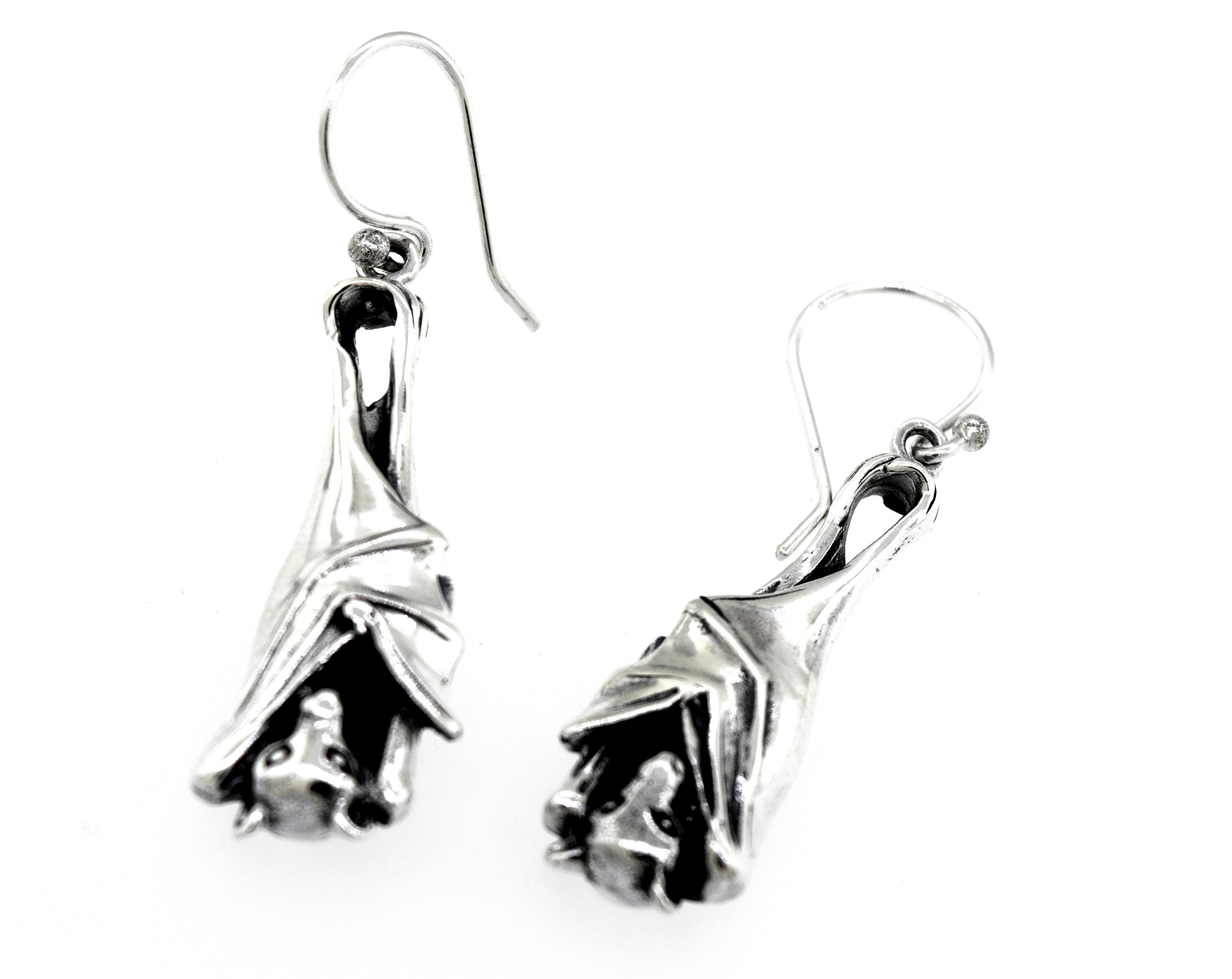 A pair of Super Silver Designer Bat Dangle Earrings on a white background.