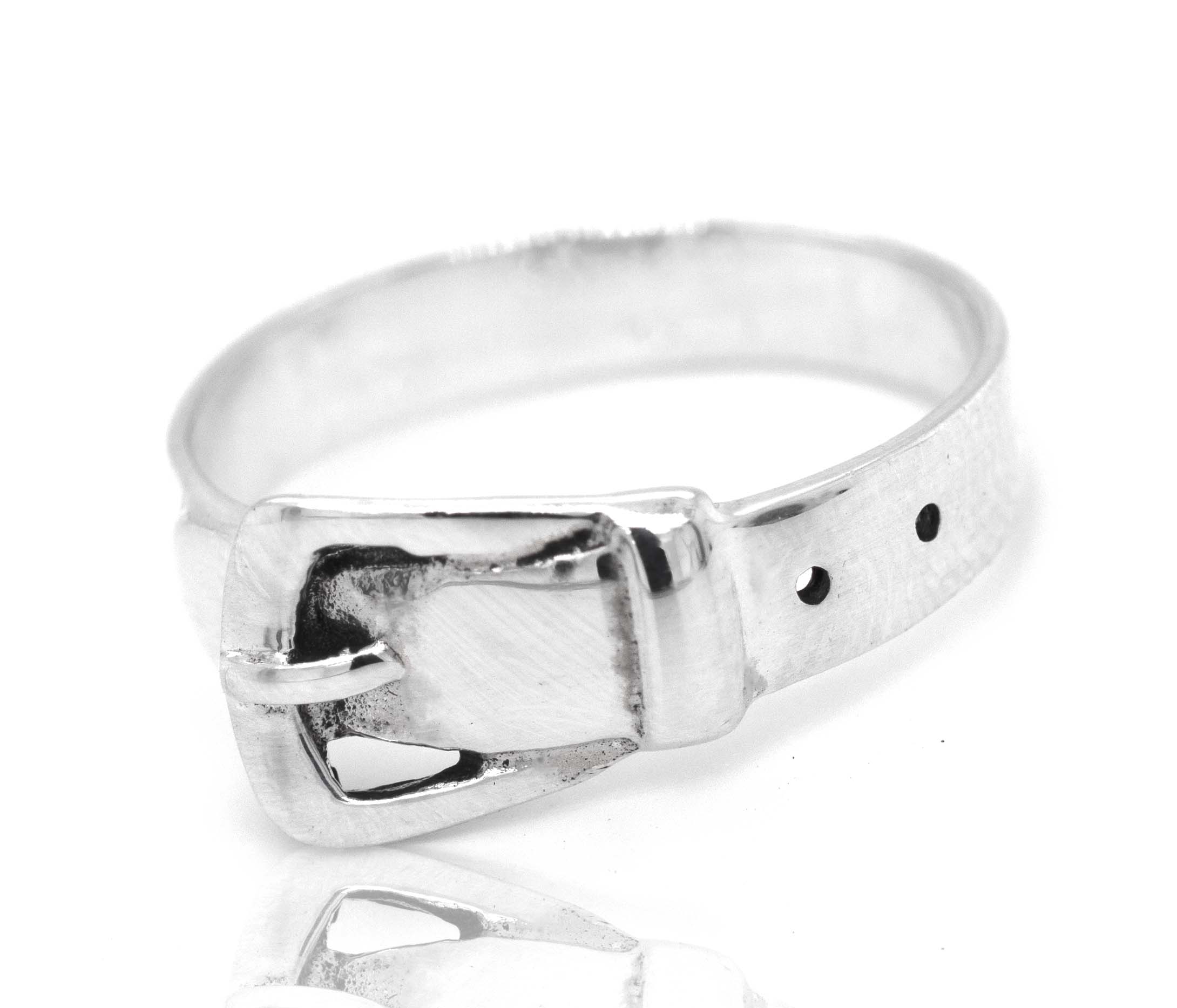 A sterling silver Belt Ring with a buckle on it, designed in the shape of a belt.